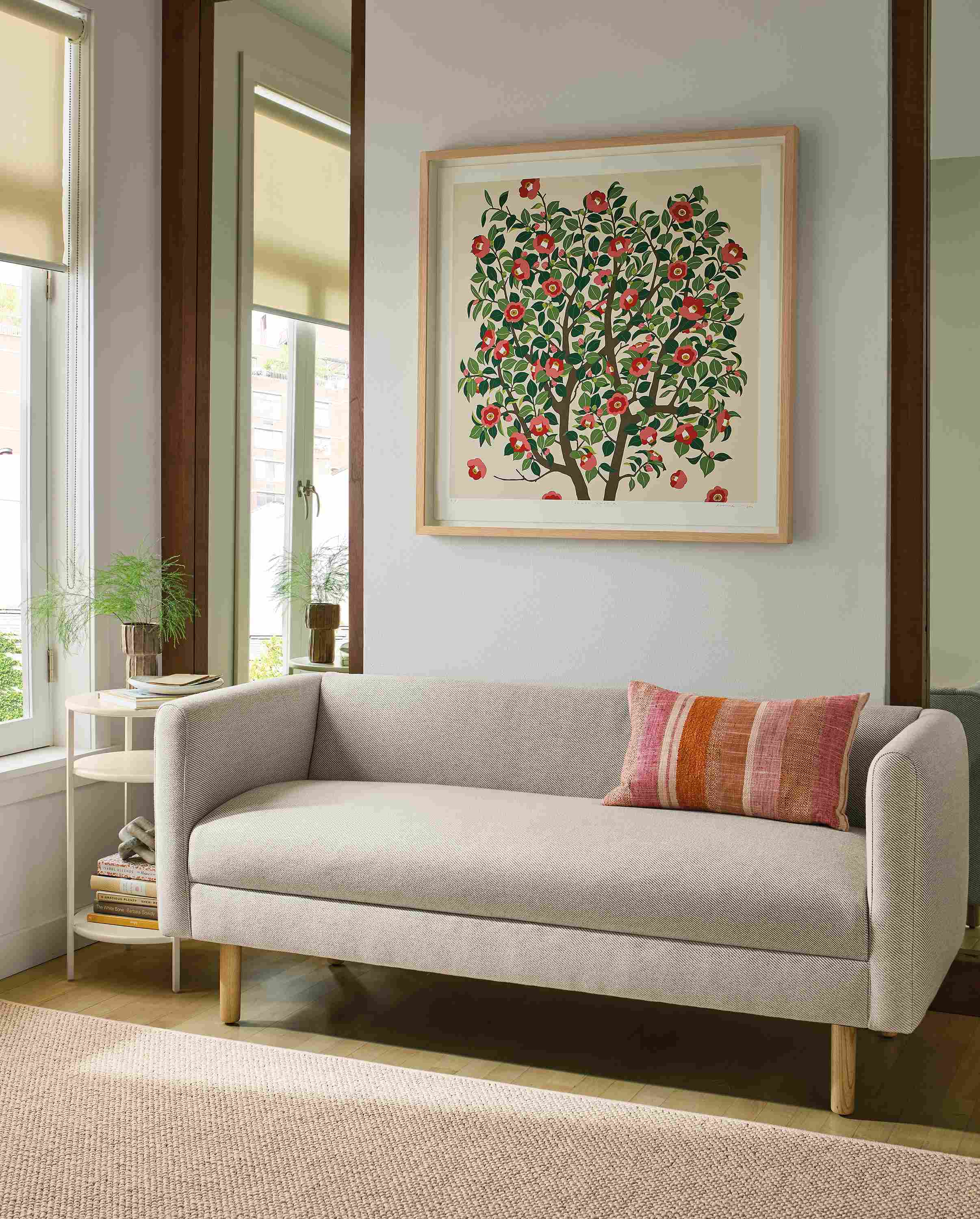 Living room with Satler bench in Derry Natural, Slim end table in bisque and Tetra throw pillow in brick.