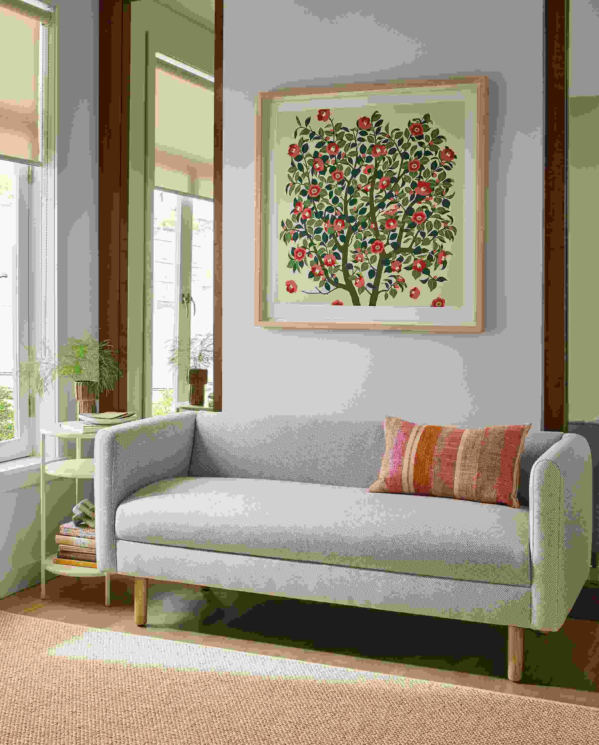 Living room with Satler bench in Derry Natural, Slim end table in bisque and Tetra throw pillow in brick.