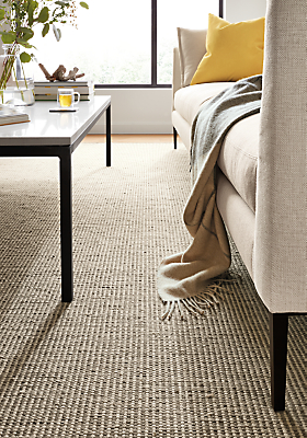Detail image of selby rug in taupe with parsons coffee table in natural steel.