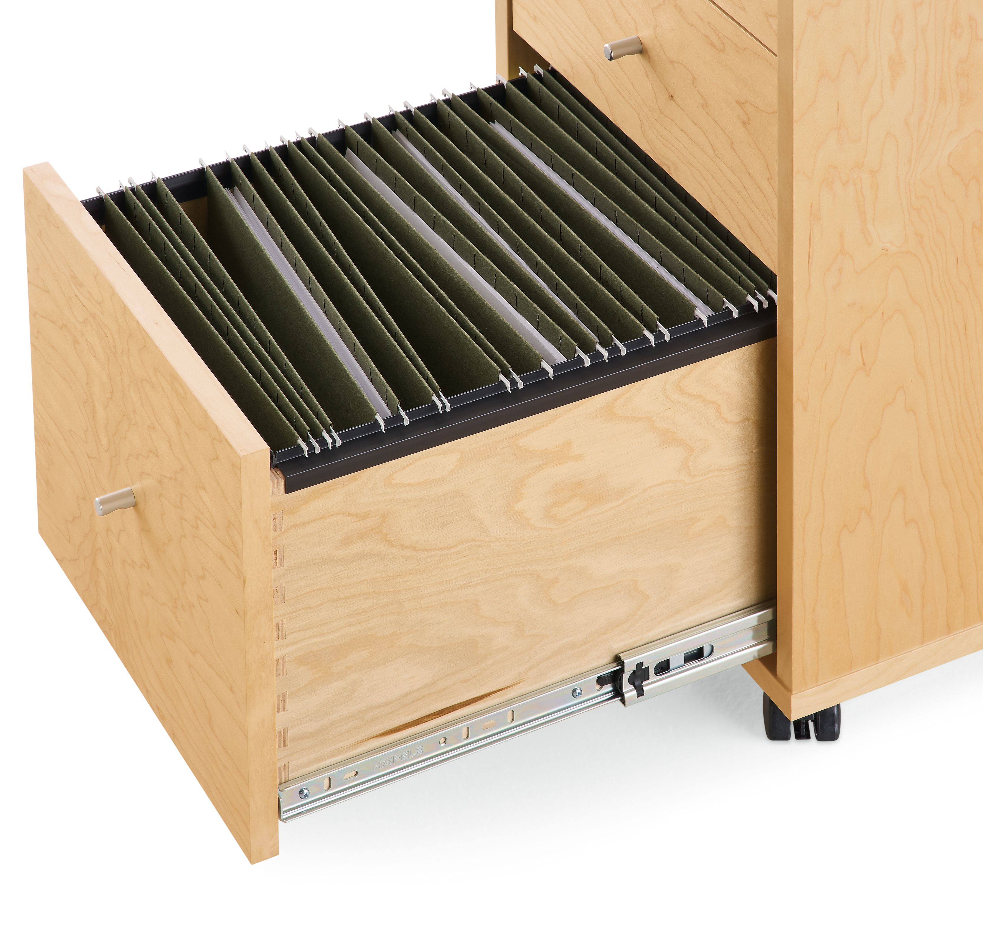 Detail of file drawer on Sequel 16-wide rolling file cabinet in Maple showing letter size file folders.