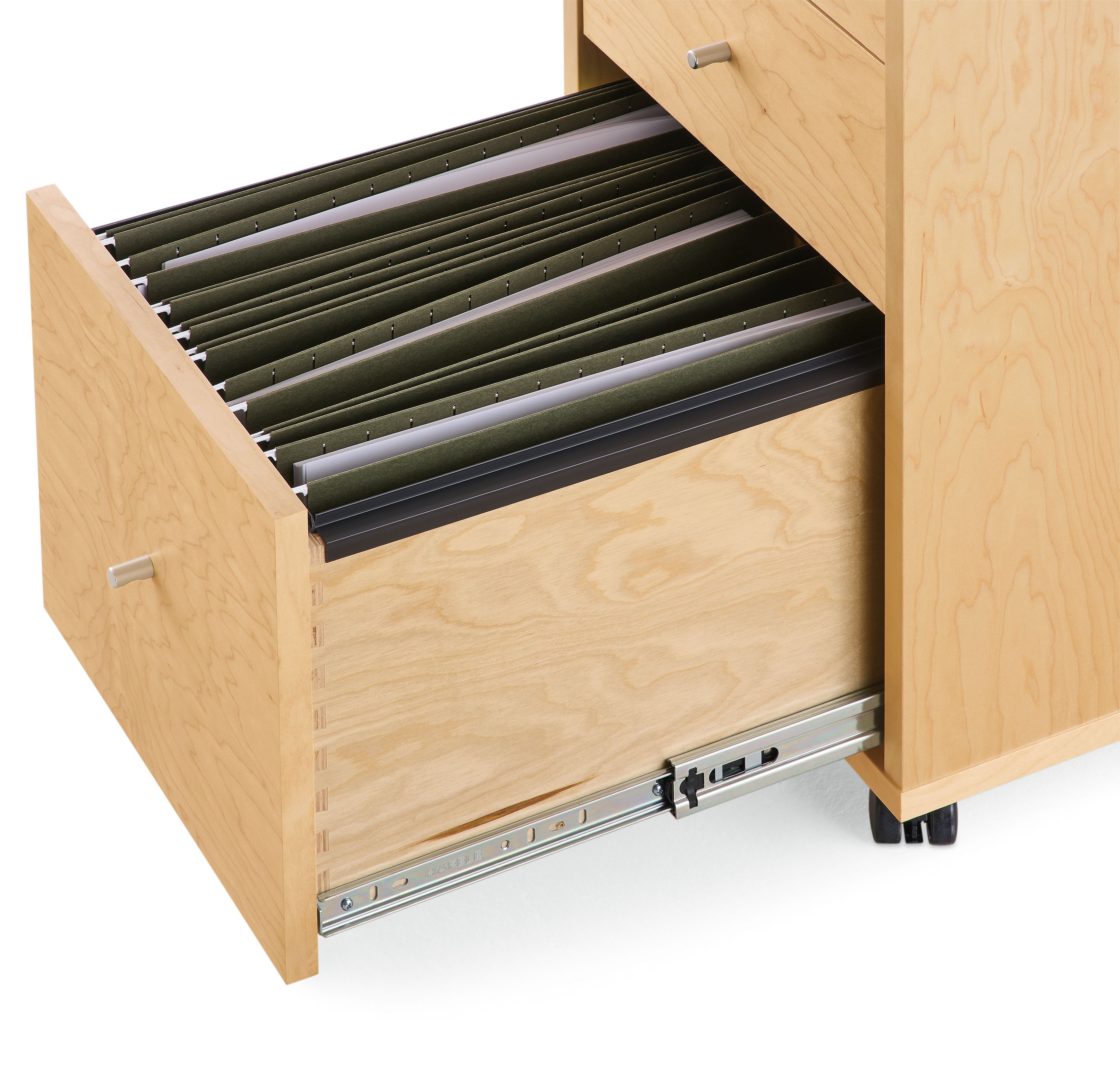 Detail of file drawer on Sequel 16-wide rolling file cabinet in Maple showing legal size file folders.