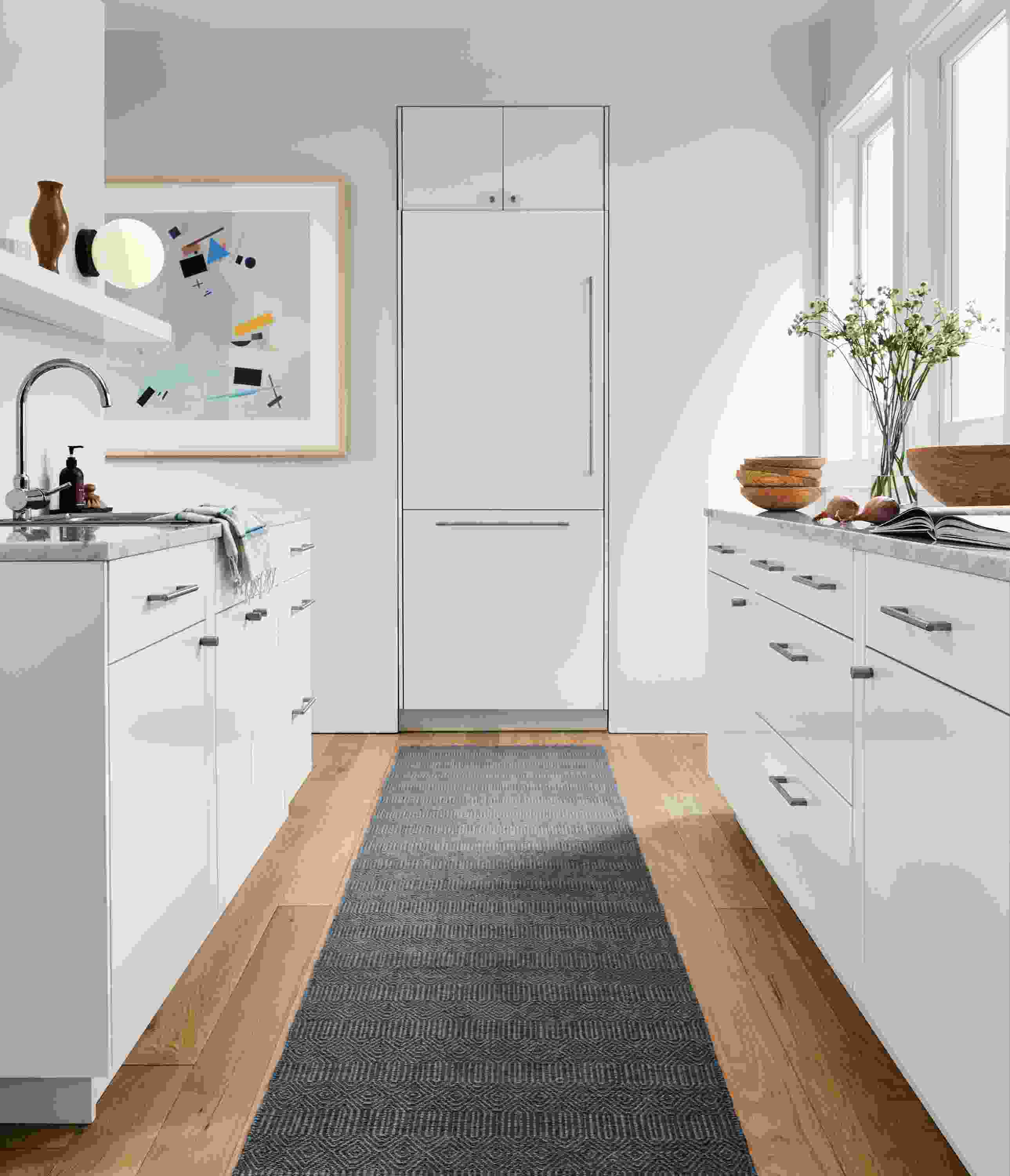 Kitchen space with sequence 2.5 by 9 rug in blue.