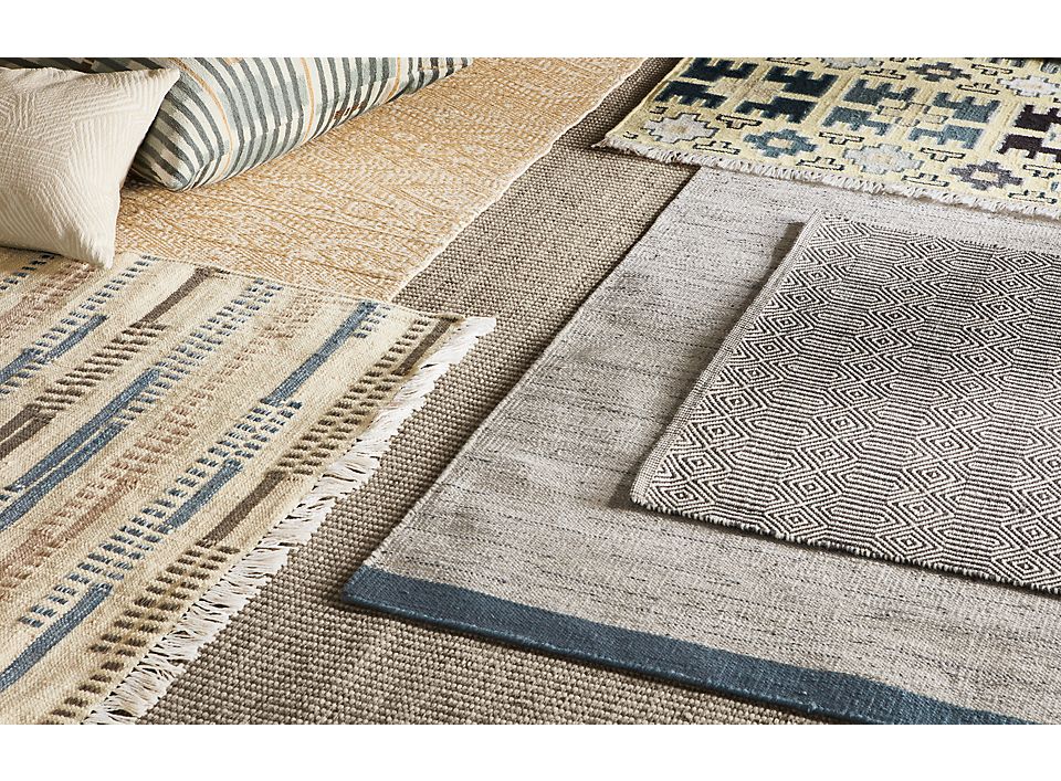 Detailed shot of indoor rugs including sequence and morse rugs.