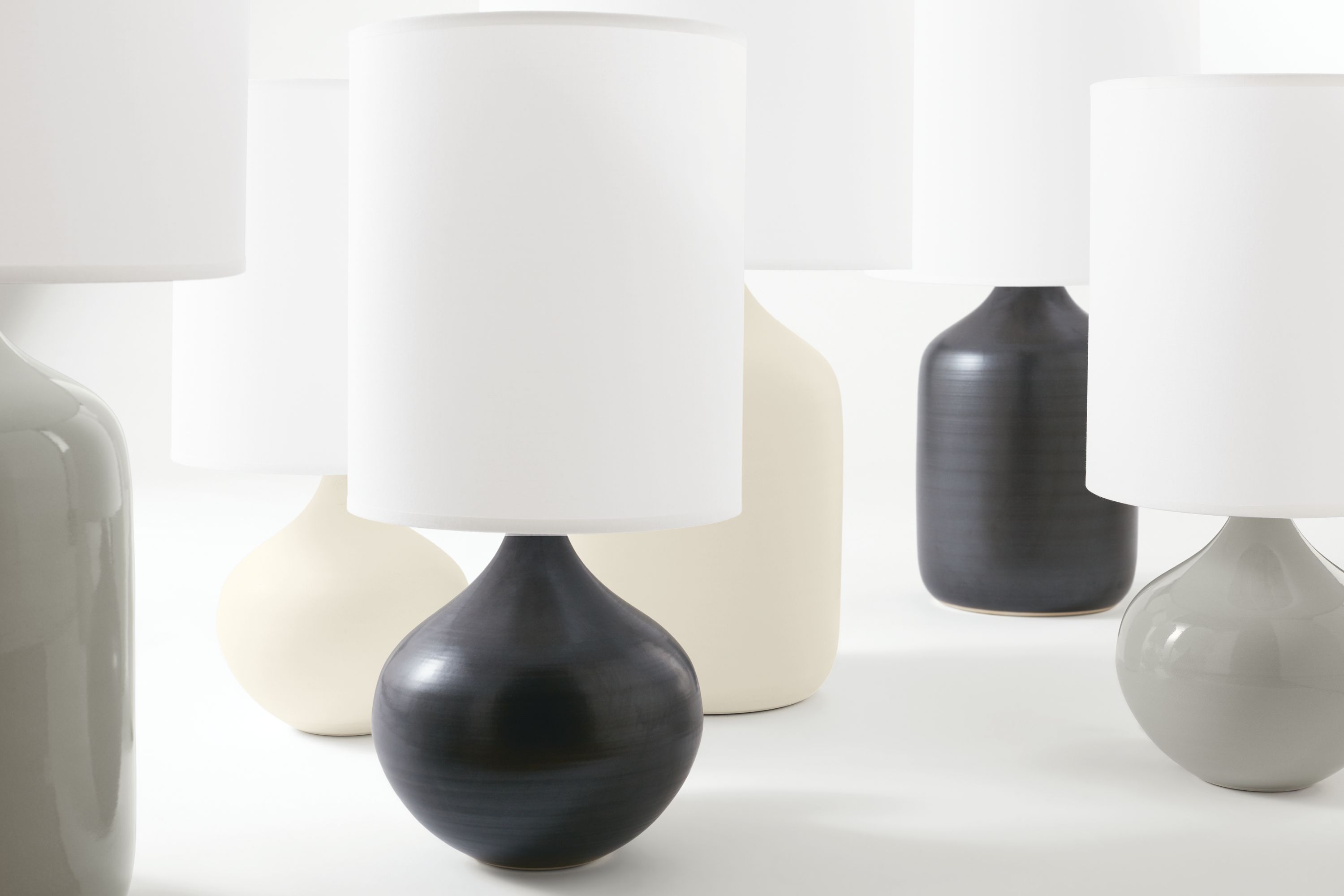 Group of Serena  and Simone table lamps in various colors.