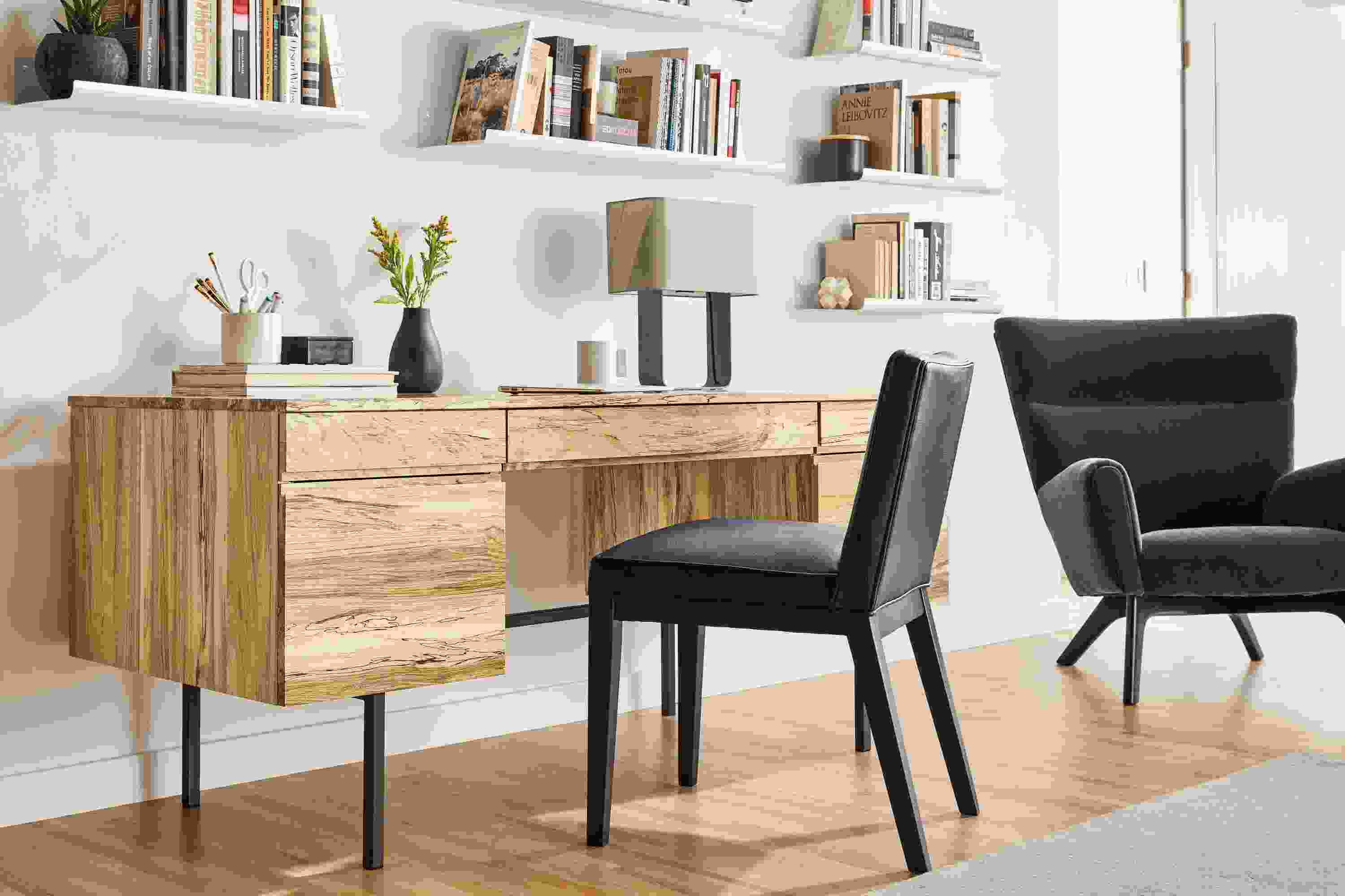 Detail of Shaw desk in spalted sugarberry with drawers and natural steel base.