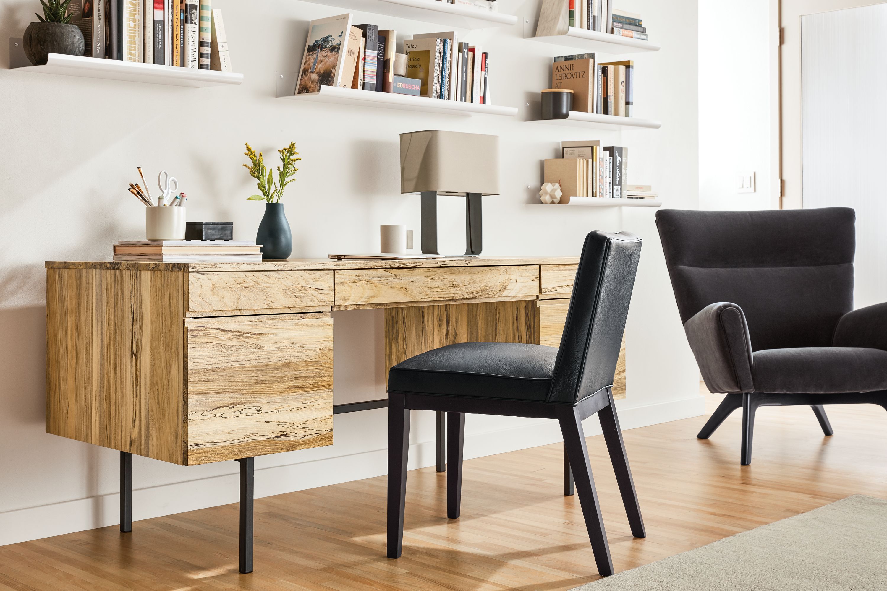 Detail of Shaw desk in spalted sugarberry with drawers and natural steel base.