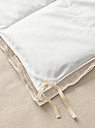 Close tie detail of queen Sheffield duvet cover in ivory.