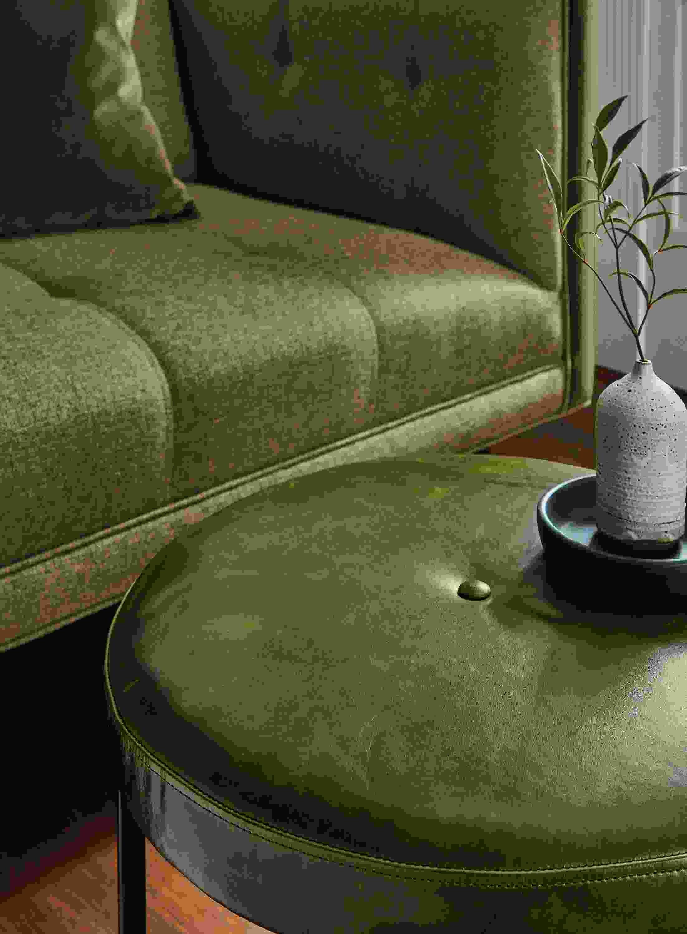 Detail of Sidney round ottoman in Vento Olive leather.