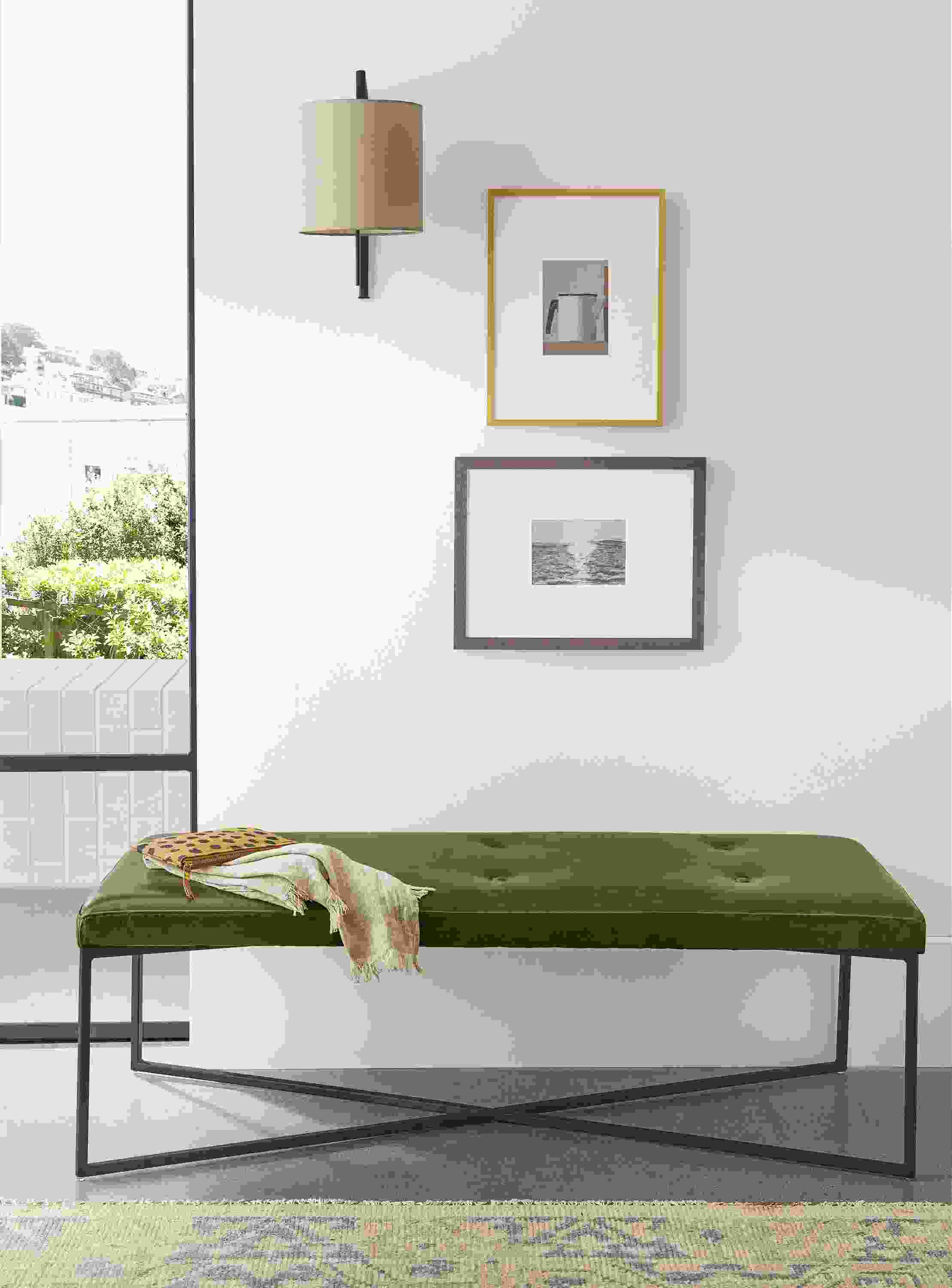 Detail of rectangular Sidney ottoman in Vento Olive leather in entryway.