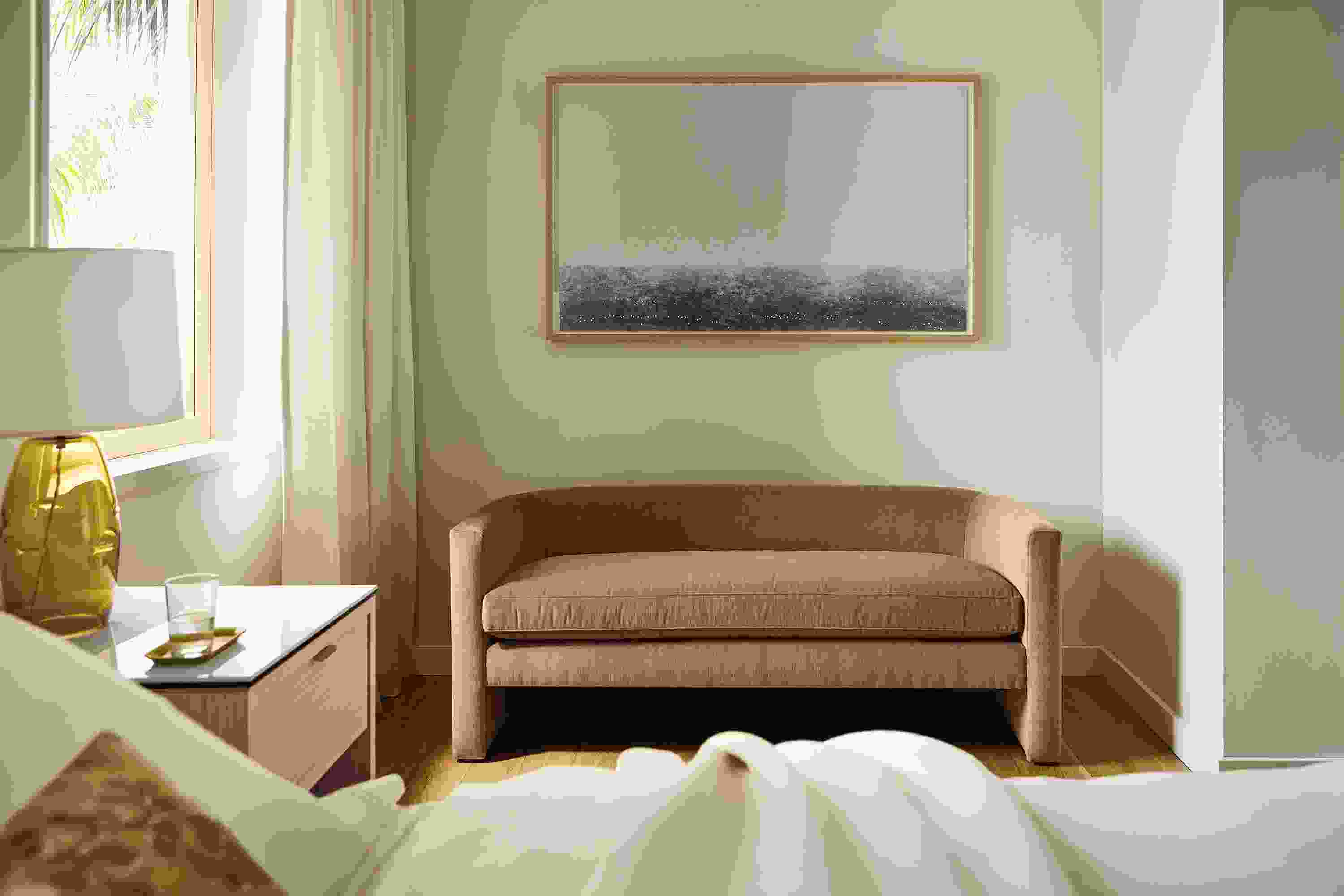 Bedroom seating area with silva bench in windsor cognac and artwork by ayomi yoshida, north sea calm morning.
