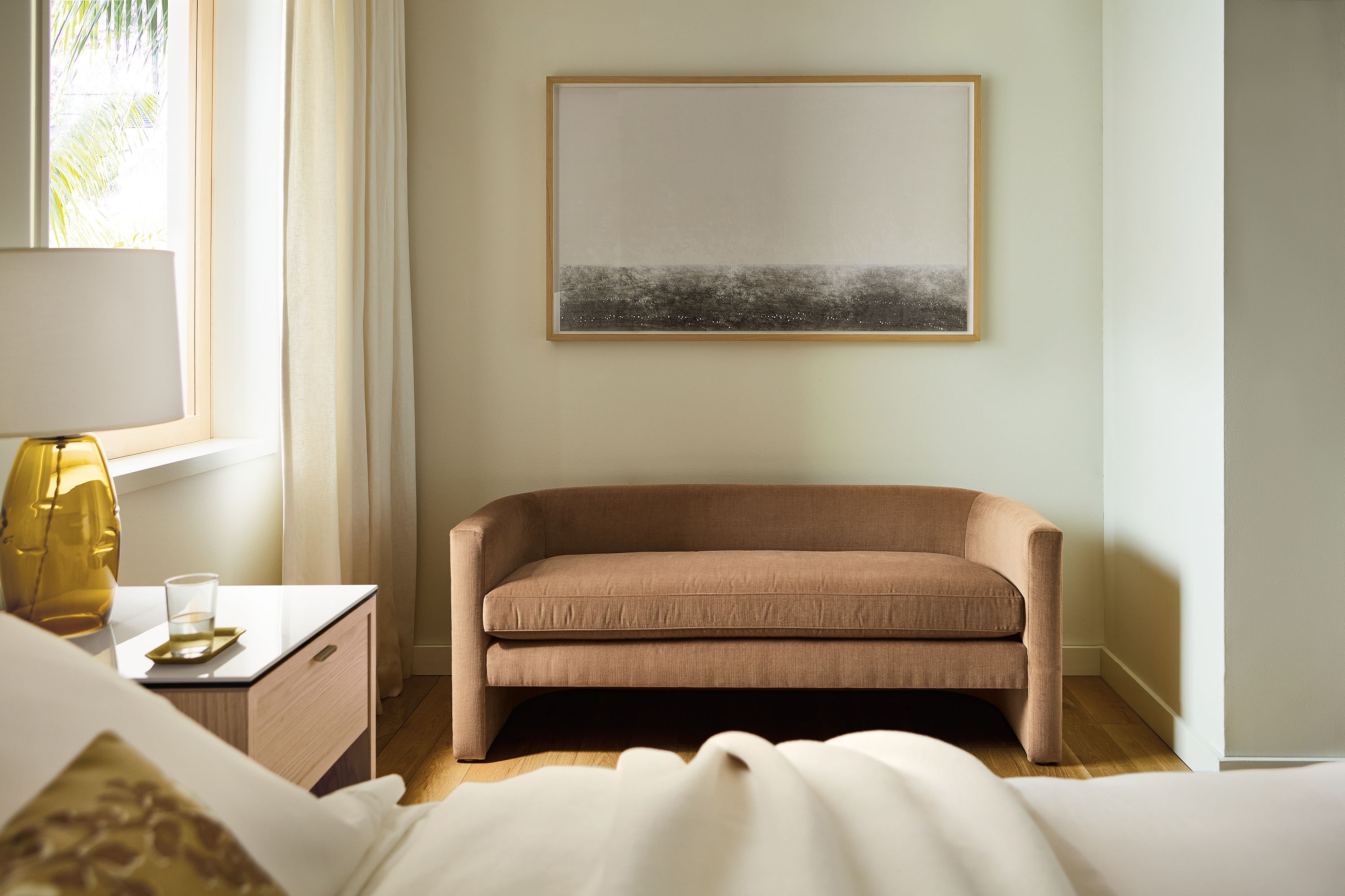Bedroom seating area with silva bench in windsor cognac and artwork by ayomi yoshida, north sea calm morning.
