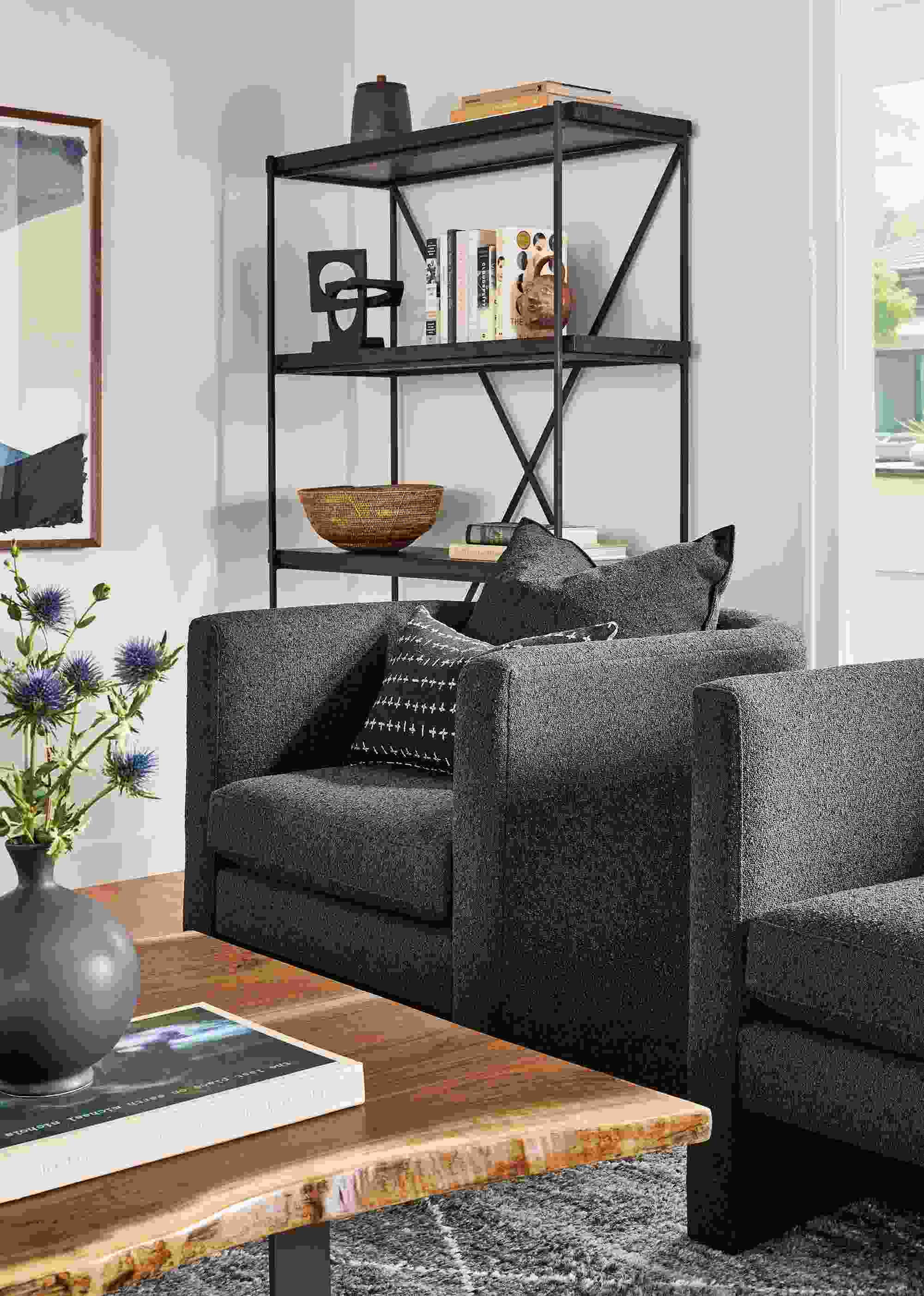 Living room detail of 2 Silva chairs in Declan Graphite and Chilton coffee table in walnut.