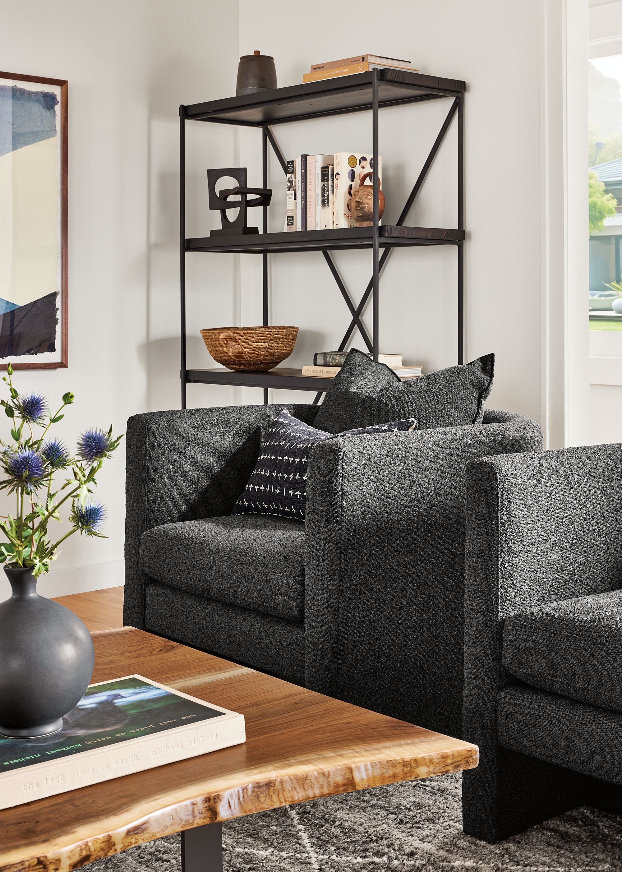 Living room detail of 2 Silva chairs in Declan Graphite and Chilton coffee table in walnut.