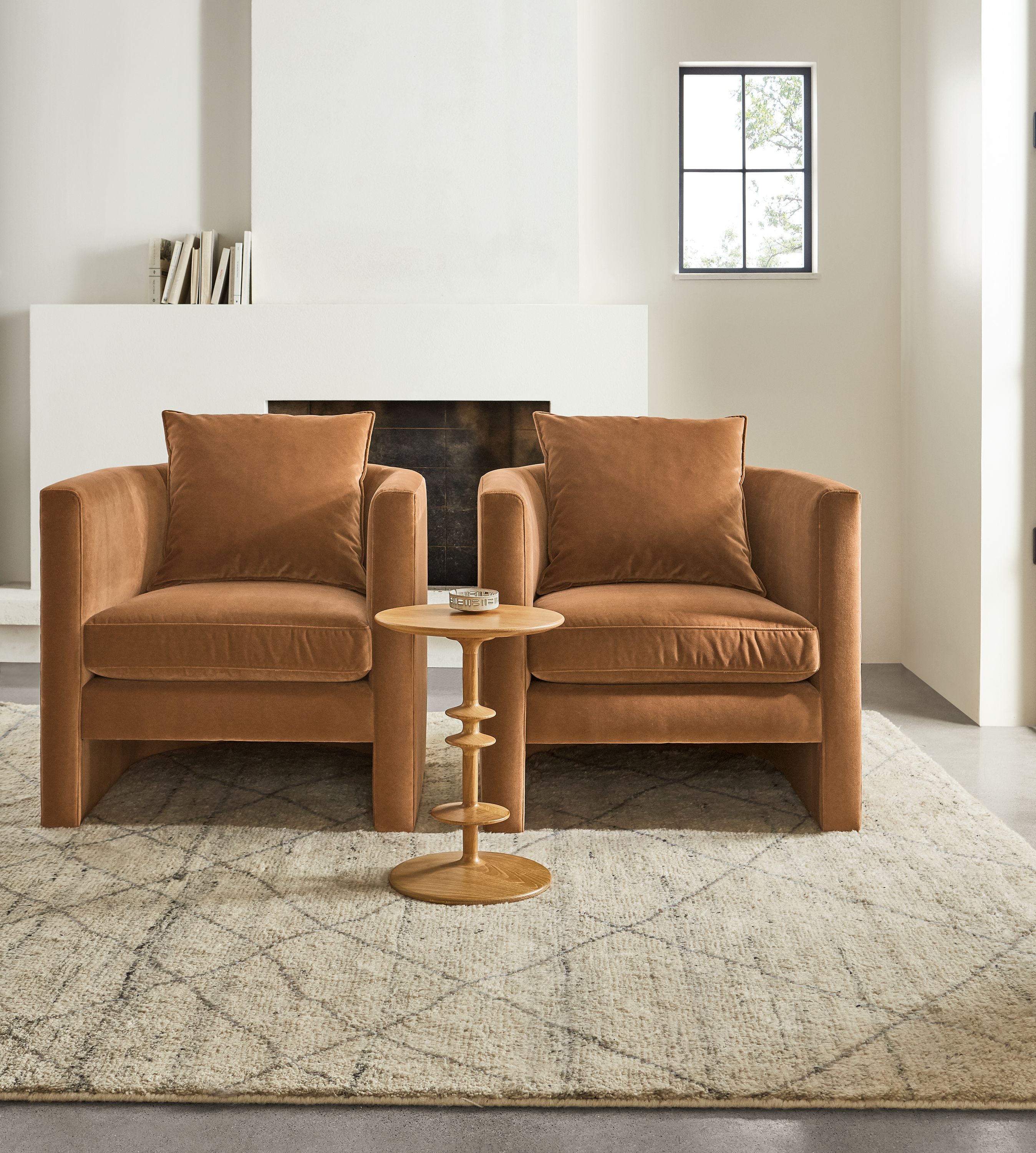 Room setting  of 2 Silva chairs in Banks Cognac velvet with Parks end table in white oak.