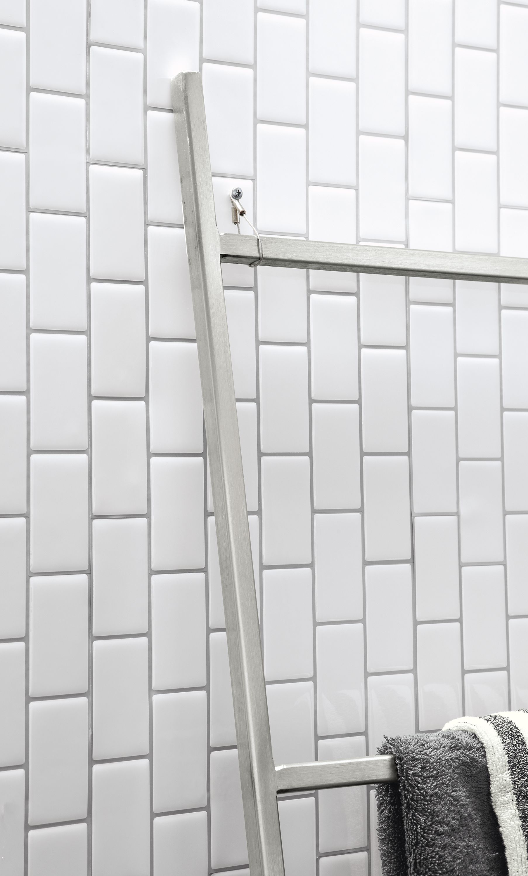 Detail of anti-tip safety hardware for Slim ladder.
