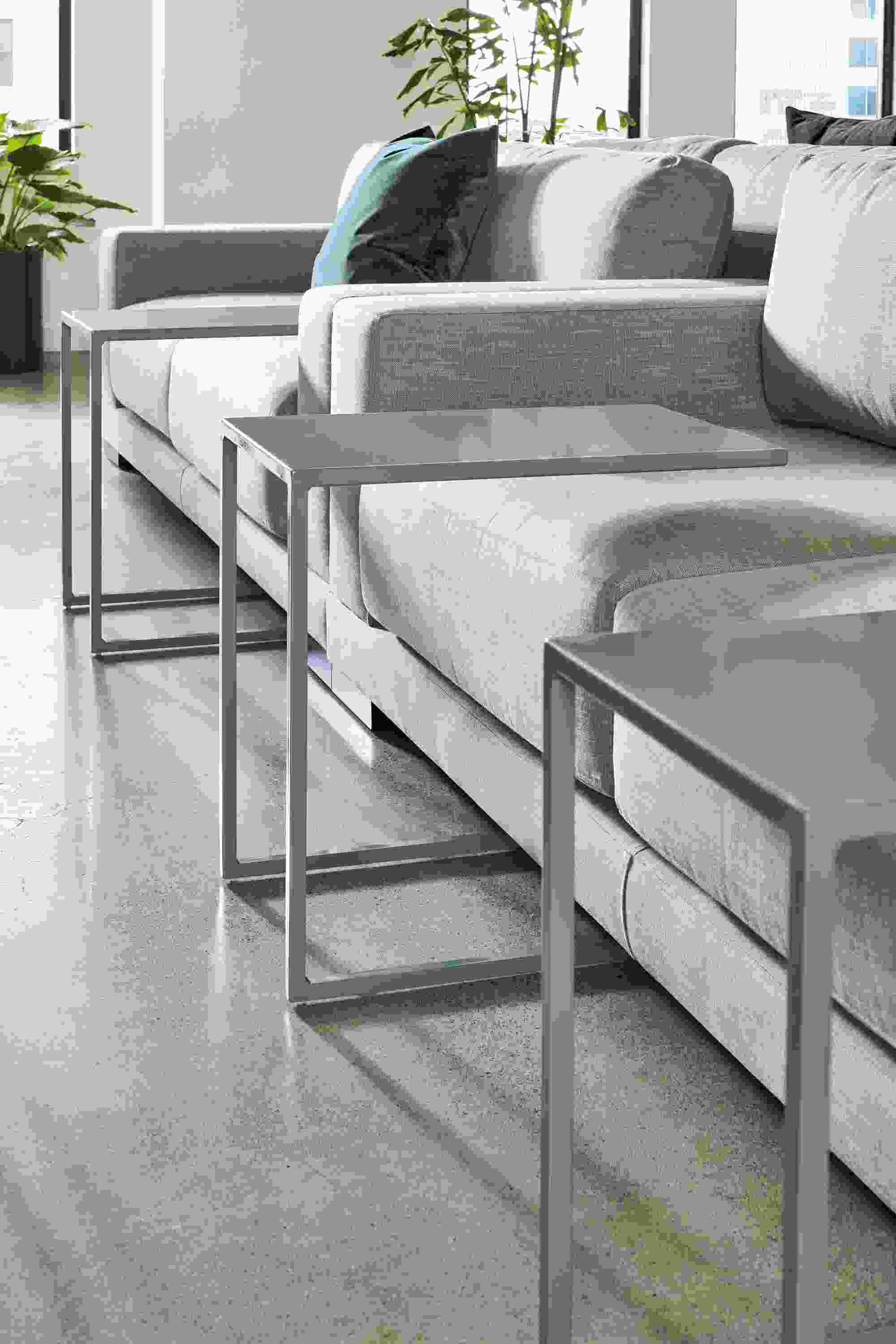 Business Interiors image of slim c-shaped tables in sage.
