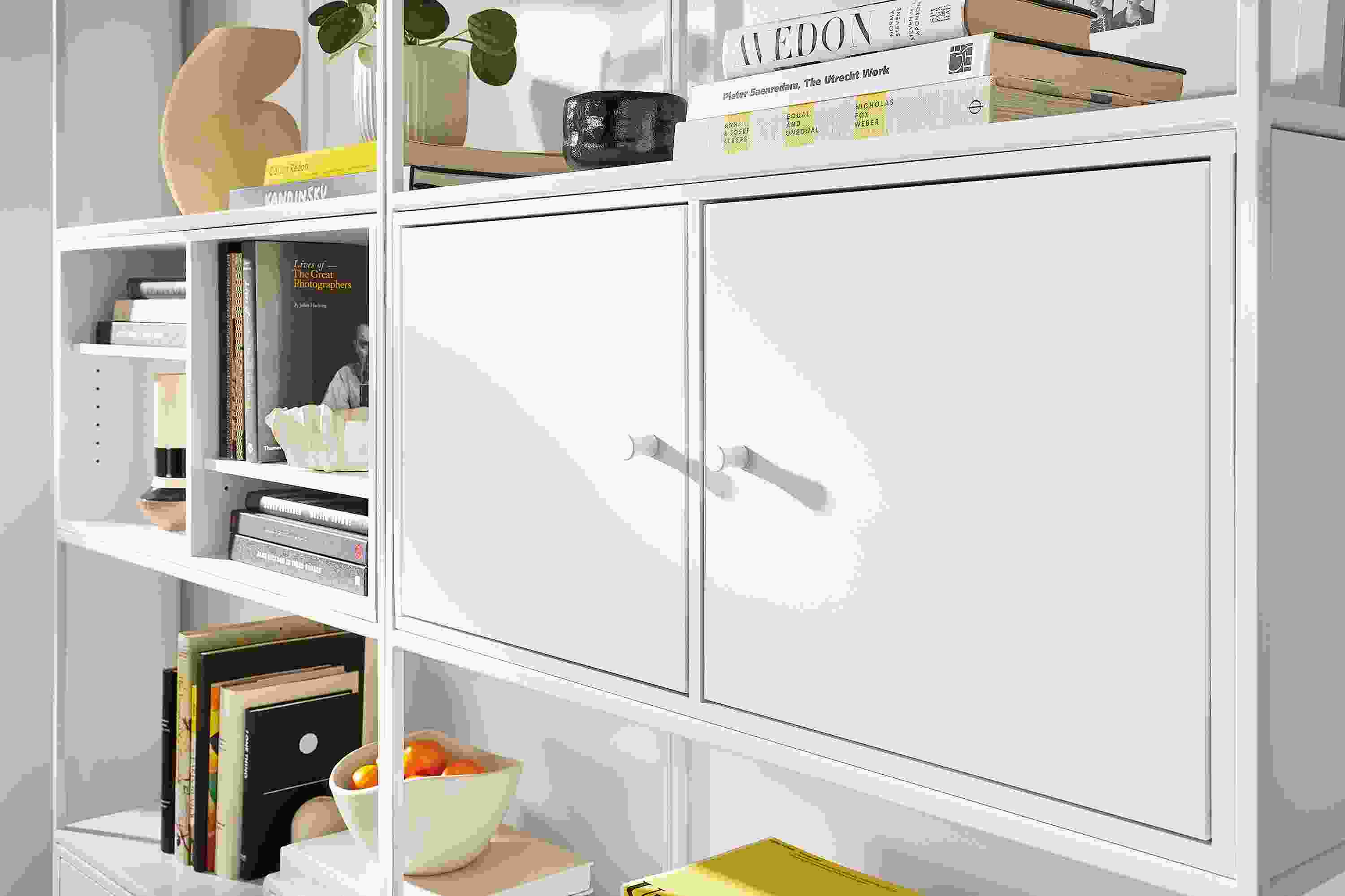 Detail of Slim 68-wide Four-Insert Wall Unit in white with white inserts.
