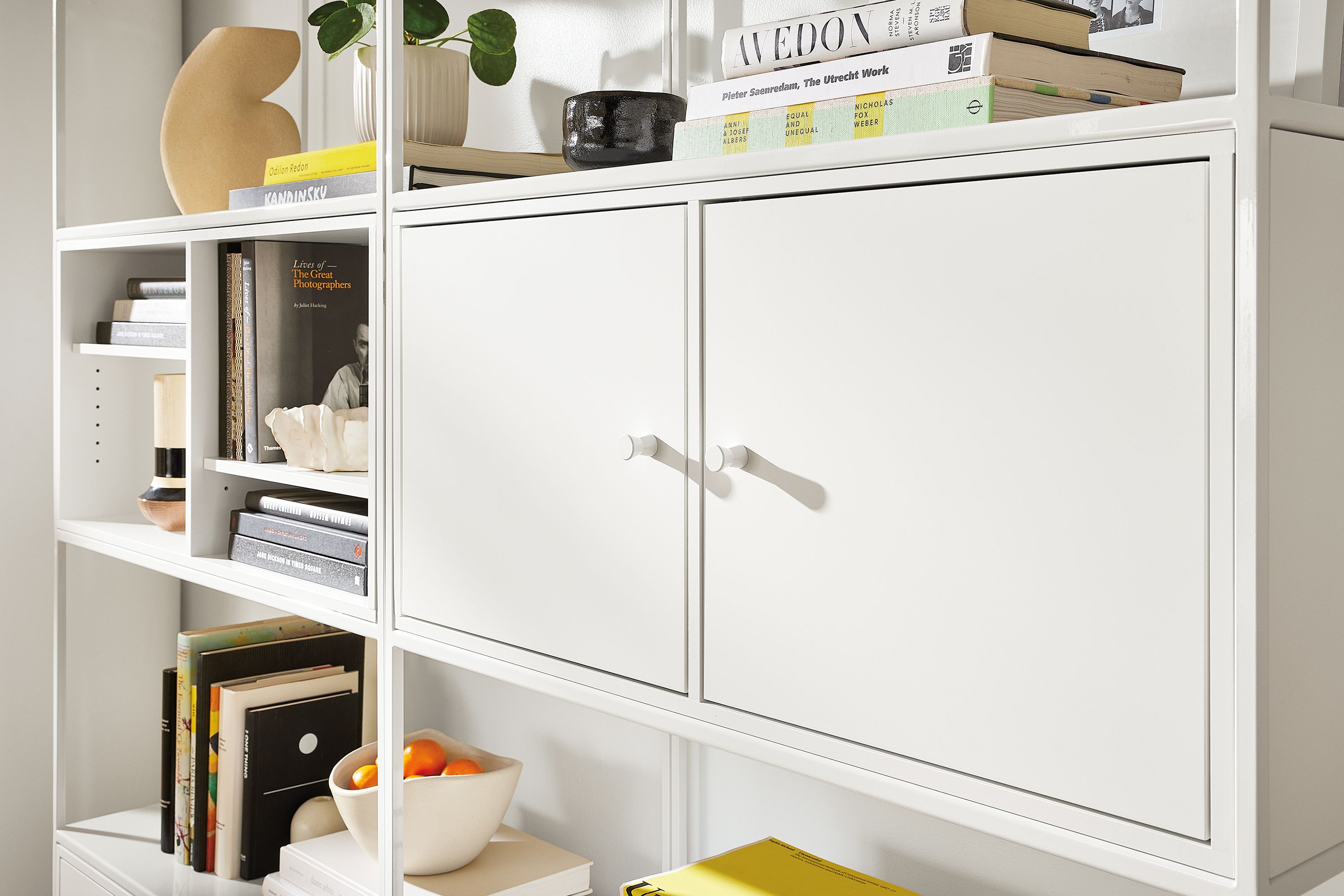 Two 34w bookcases in white with open and double door inserts