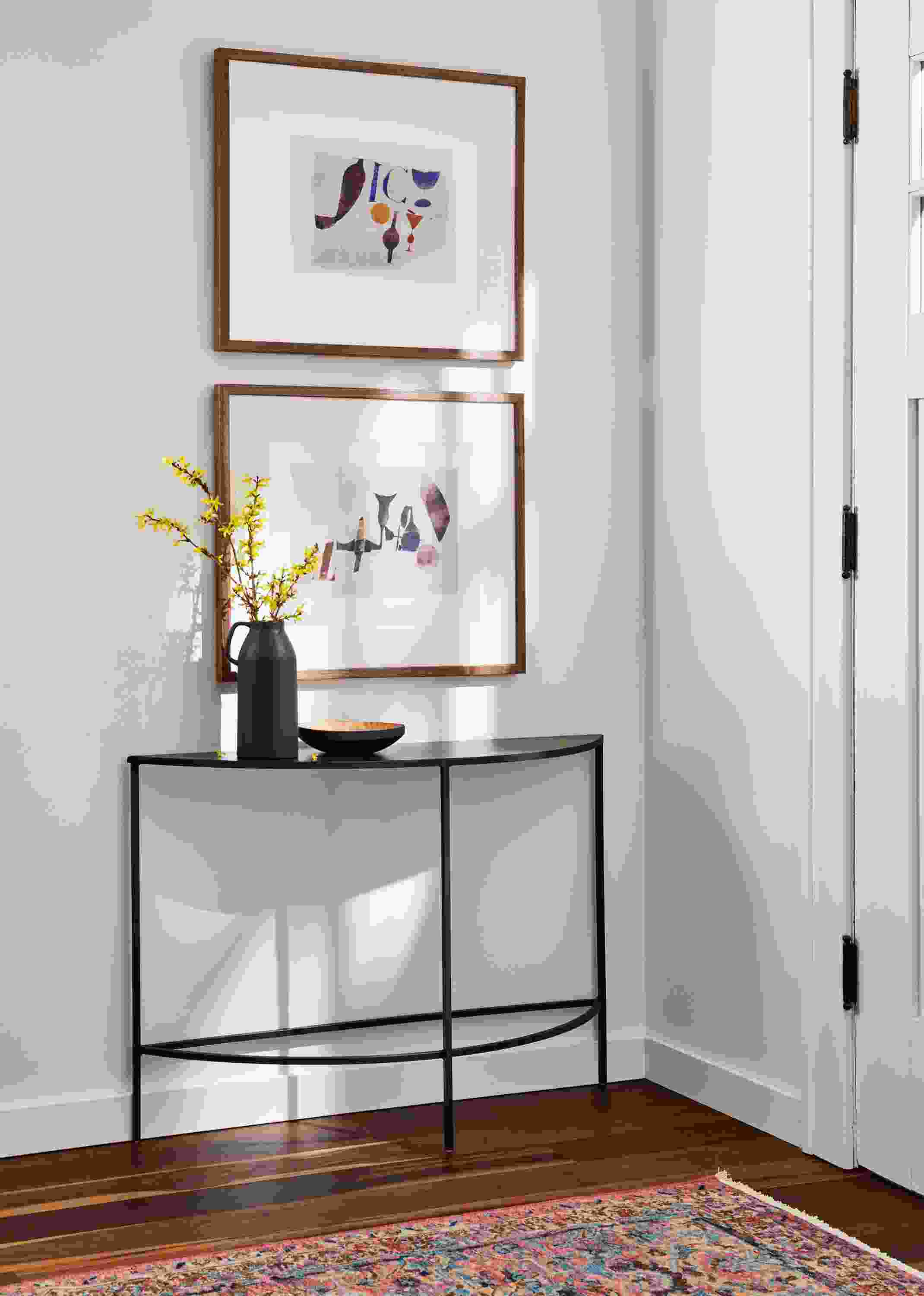Detailed slim 42-wide half-round console table in natural steel.