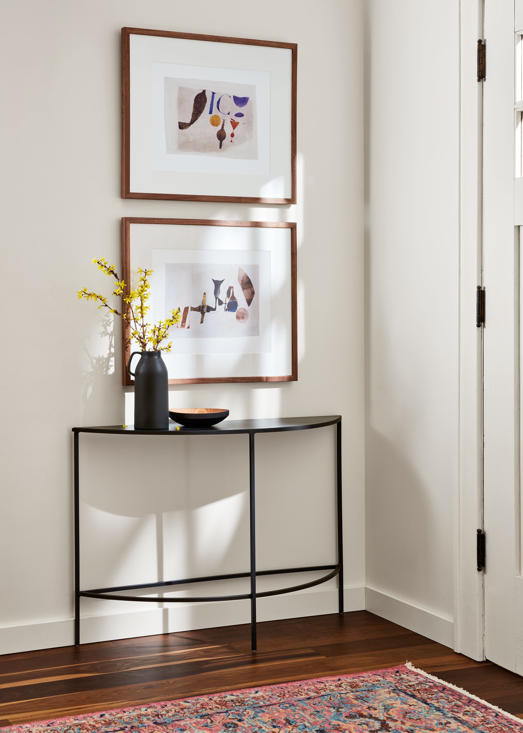 Detailed slim 42-wide half-round console table in natural steel.