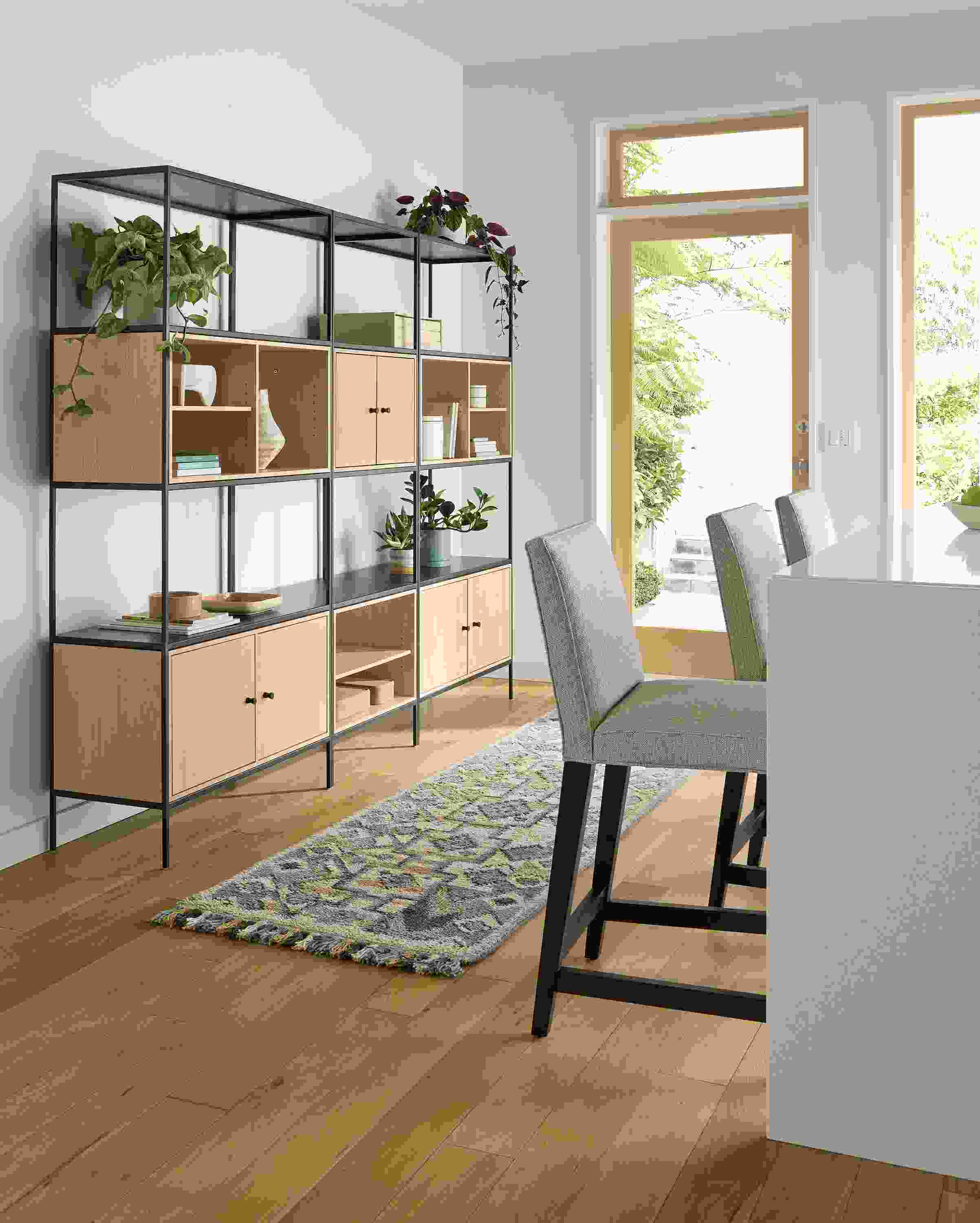 Kitchen seating area with slim 92-wide six-insert wall unit in salt on red oak and ona runner in ocean.