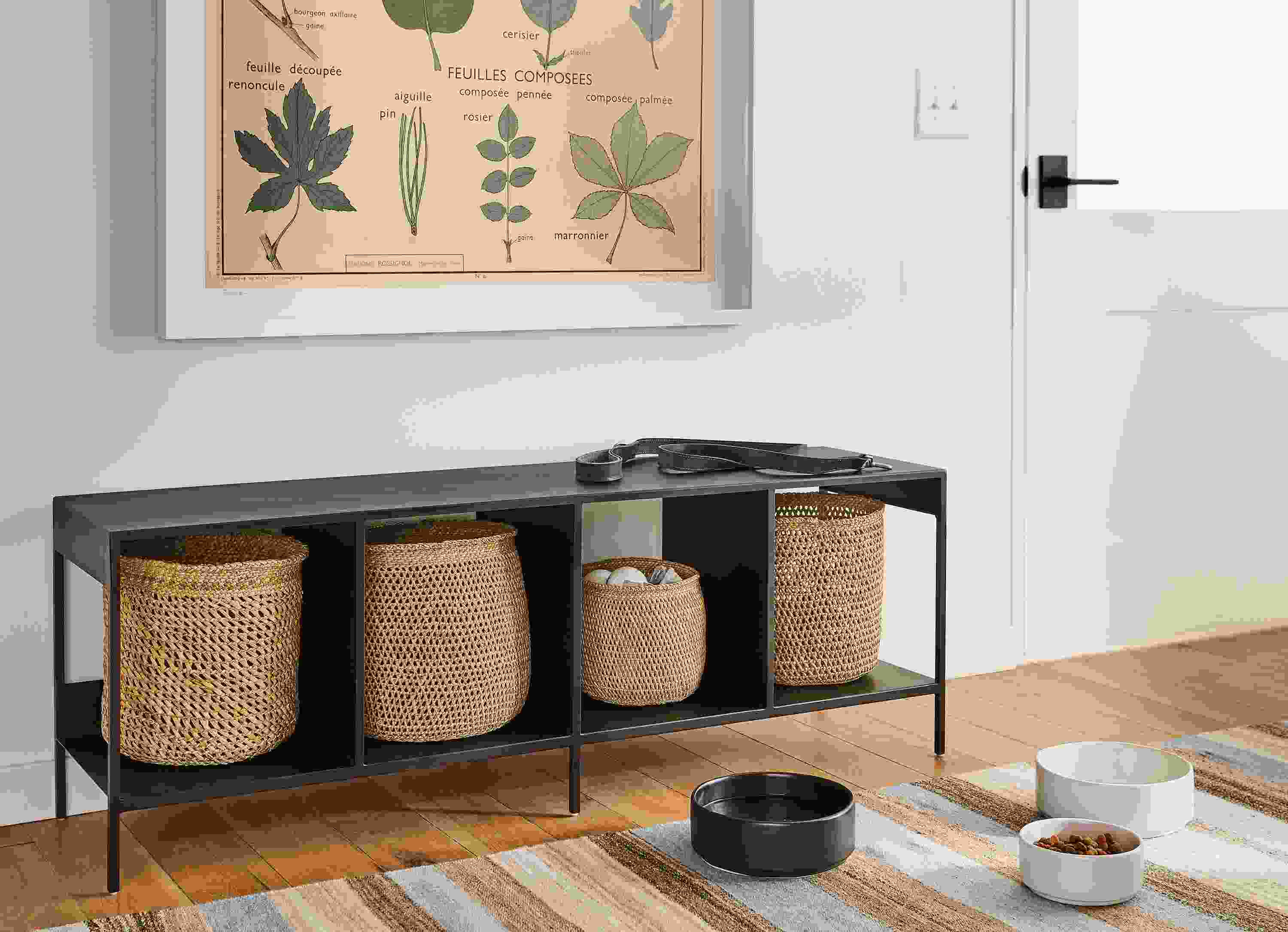 Entryway setting with slim 52-wide cubby bench in natural steel with iringa baskets in natural.