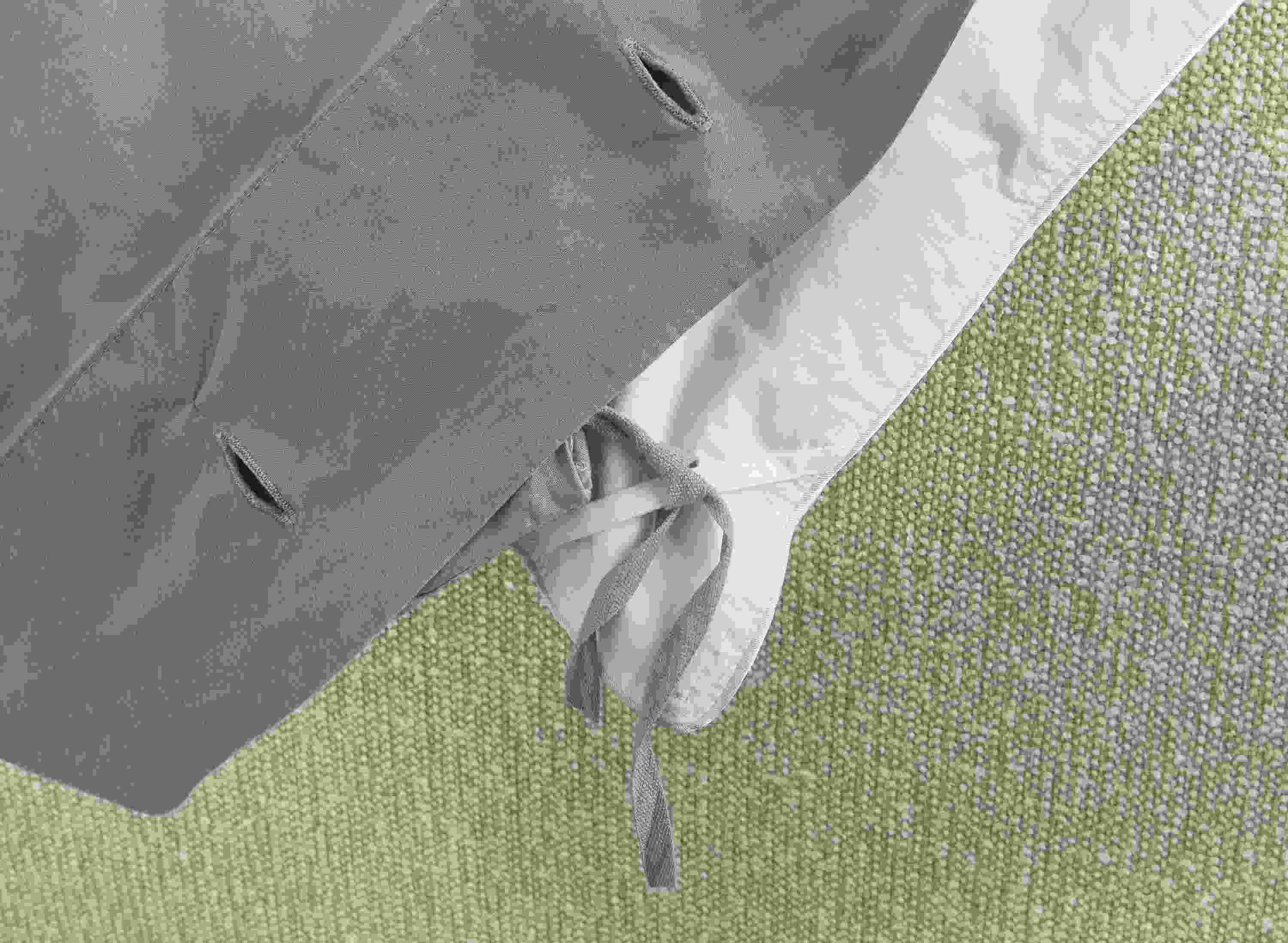 Detail of corner ties on soft-washed percale full/queen duvet set in lake colorway.