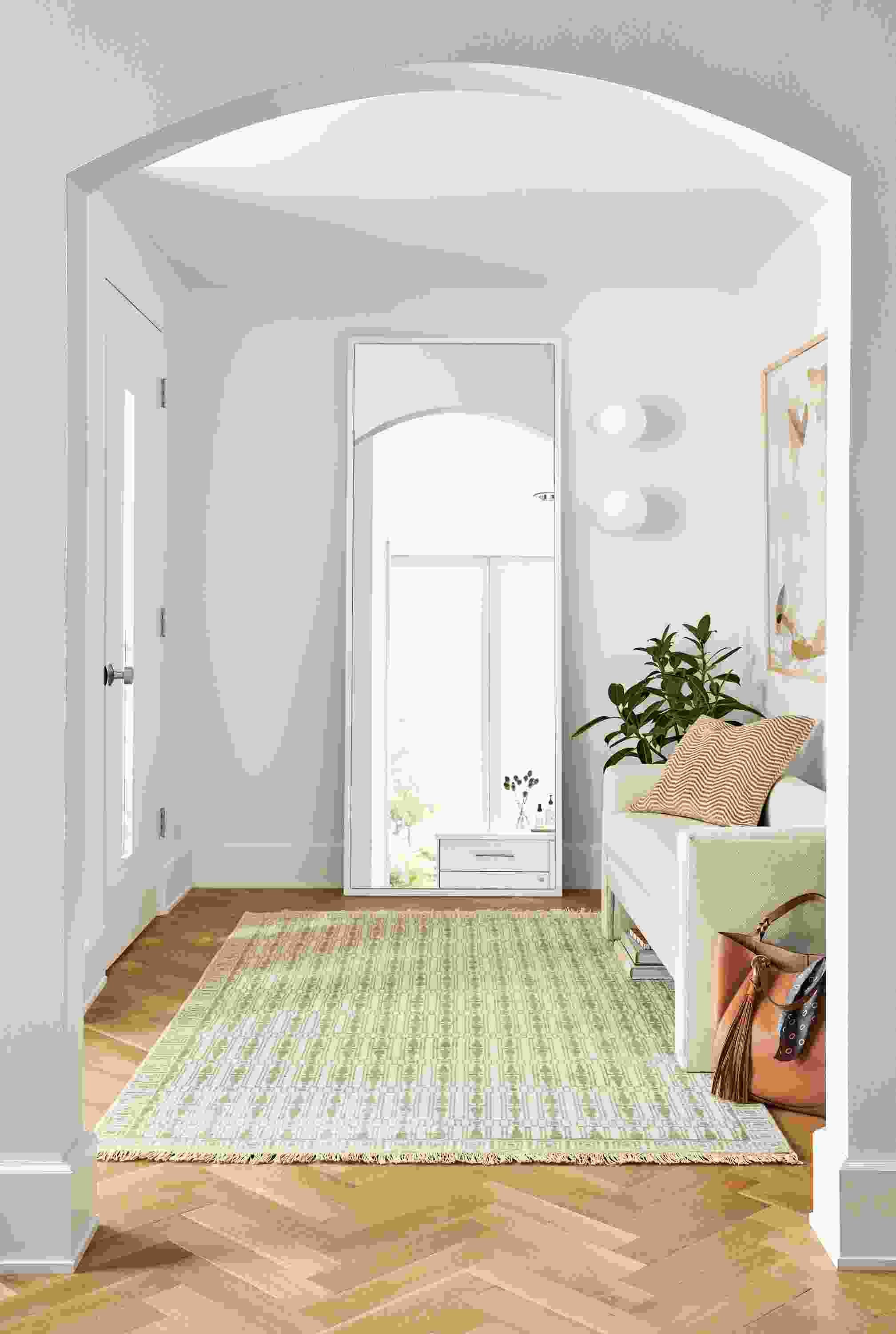 detail of soho floor mirror in entryway with silva bench