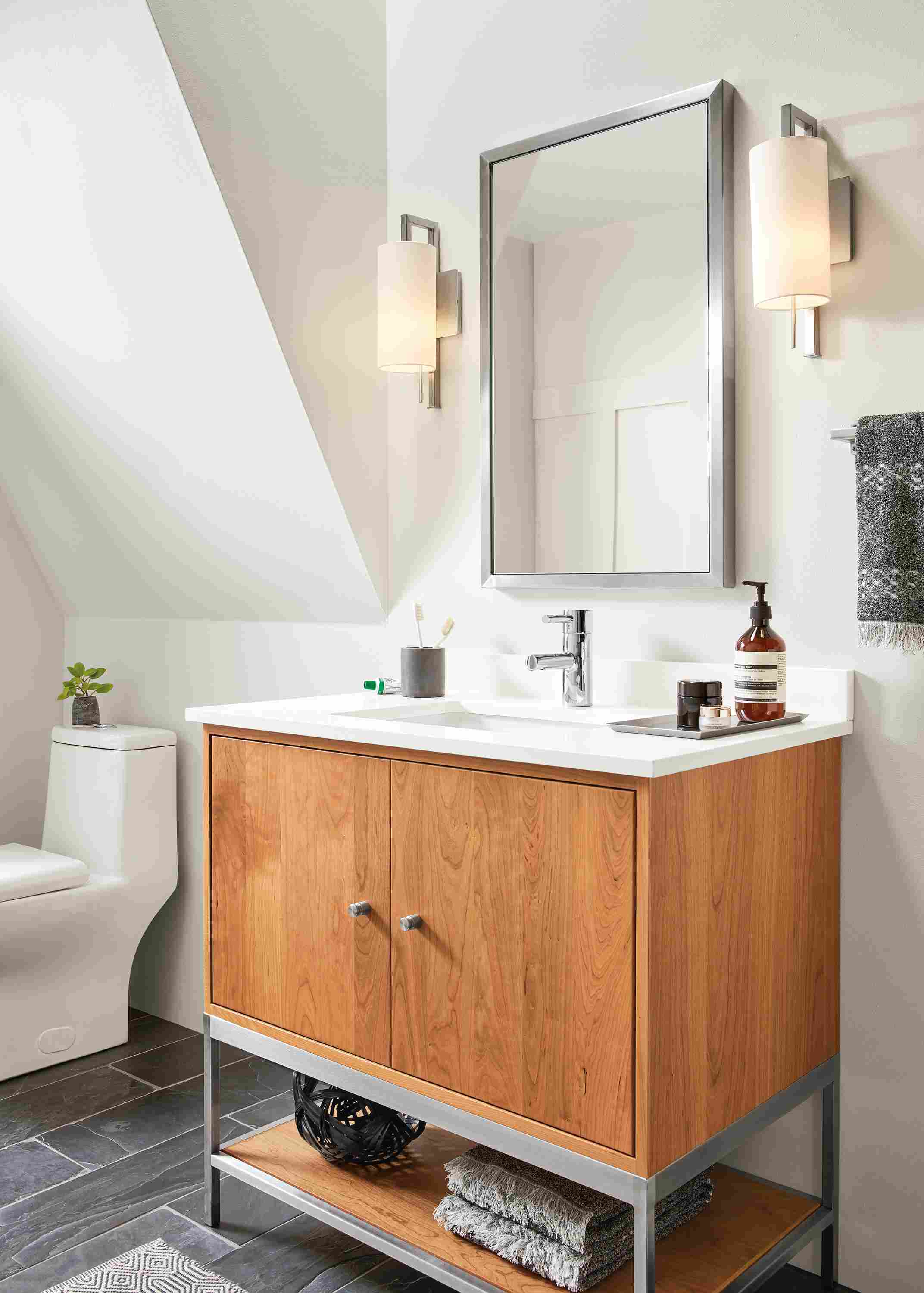 Detail of Soho wall mirror in stainless steel.