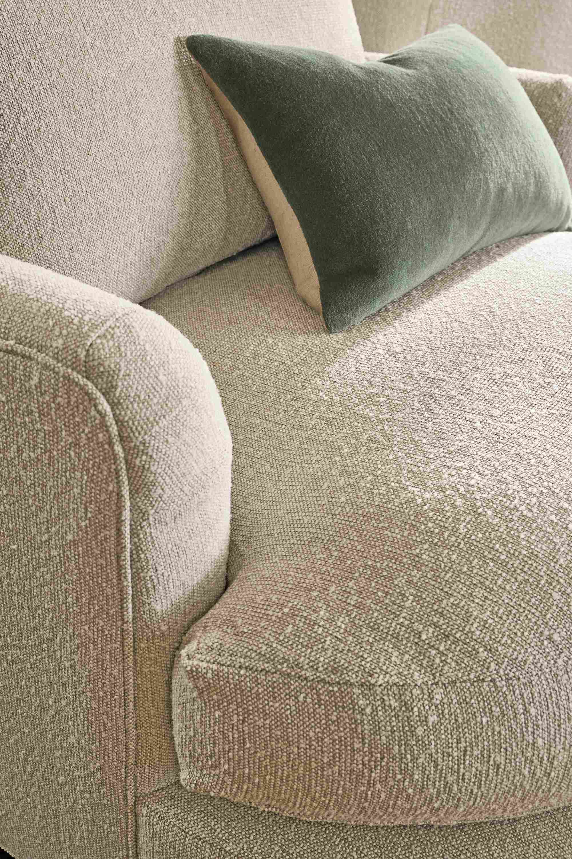 Detail of Sonja 40-wide Swivel chair in conley natural and Wool Velvet pillow in Olive.