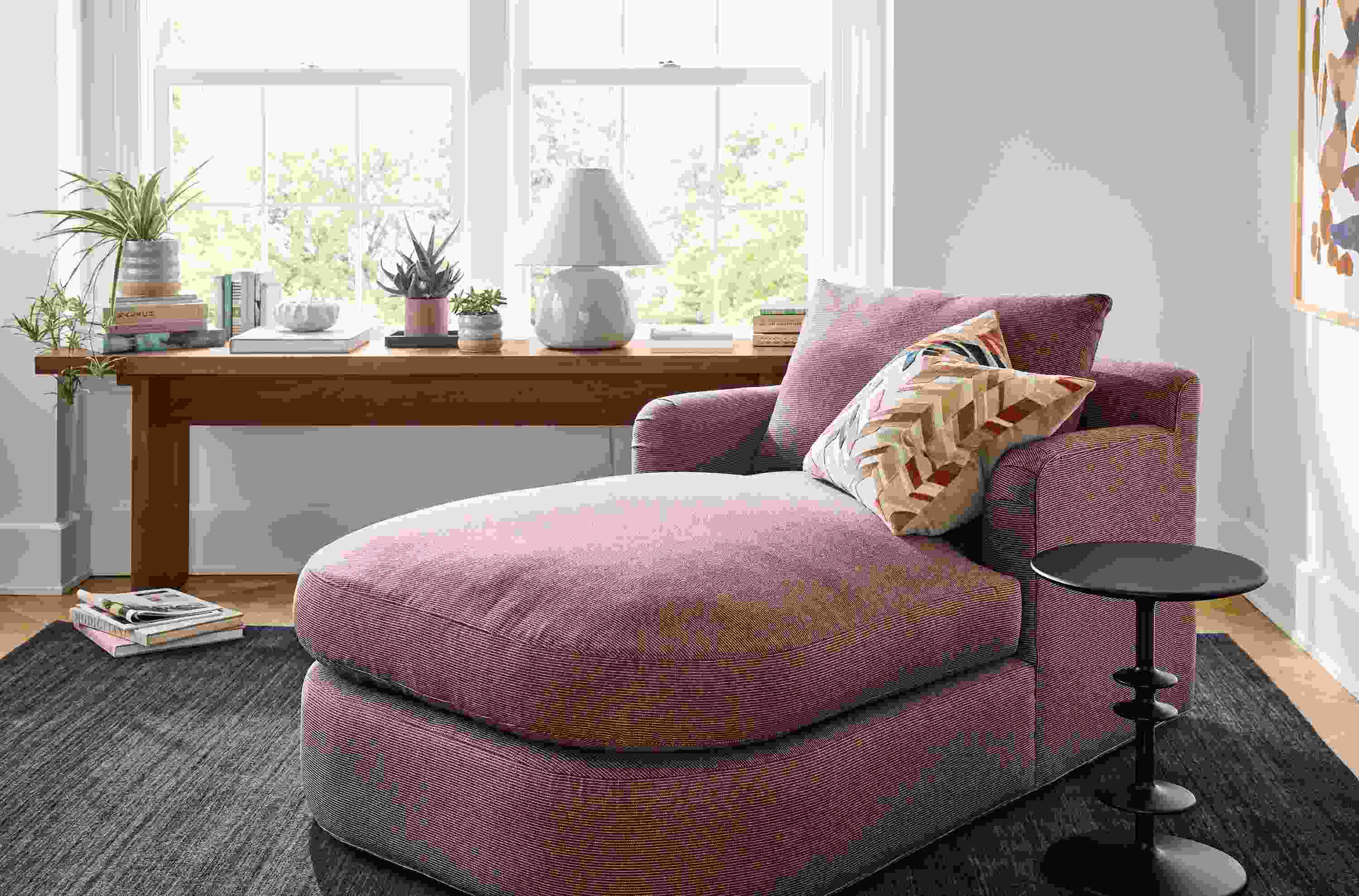 Living room with Sonja chaise in Kesler Merlot, Parks round end table in charcoal and Nomad rug in Indigo.