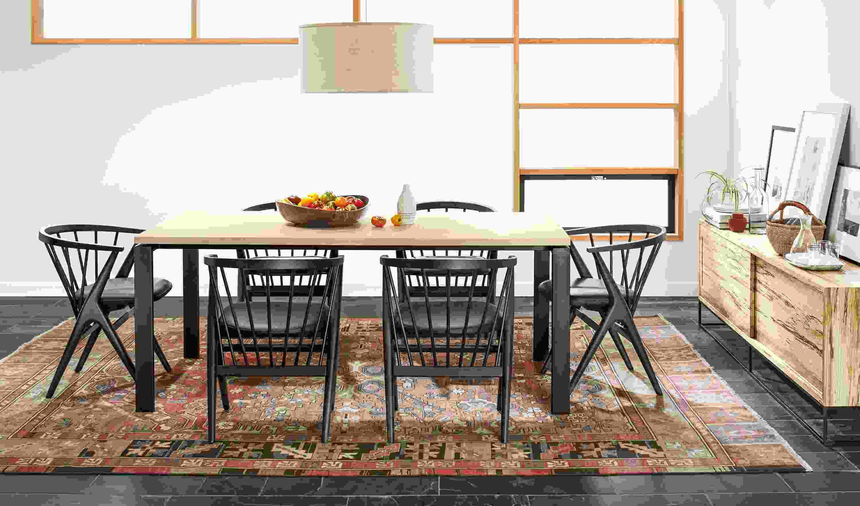 Detail of six wood Soren dining chairs