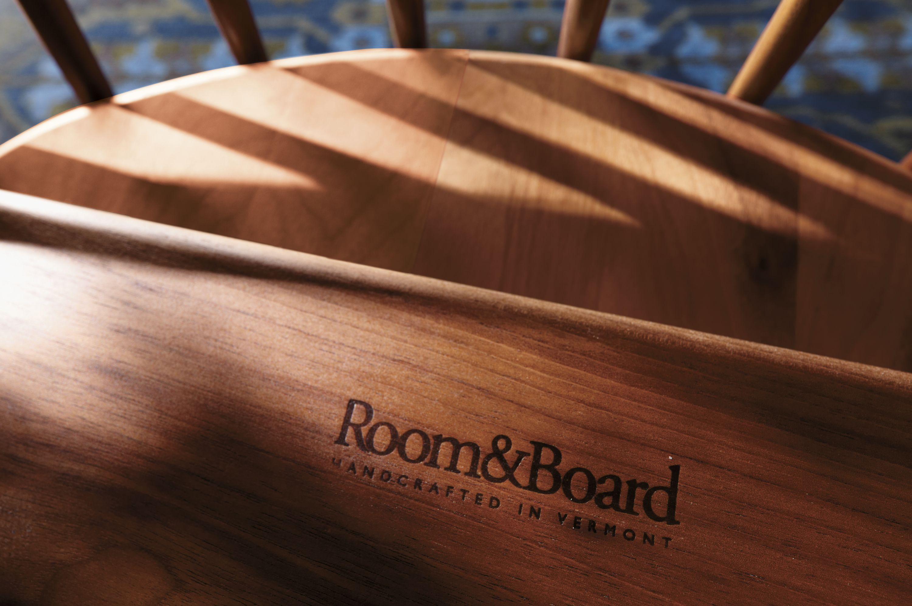 detail of soren chair in walnut on heriz rug.