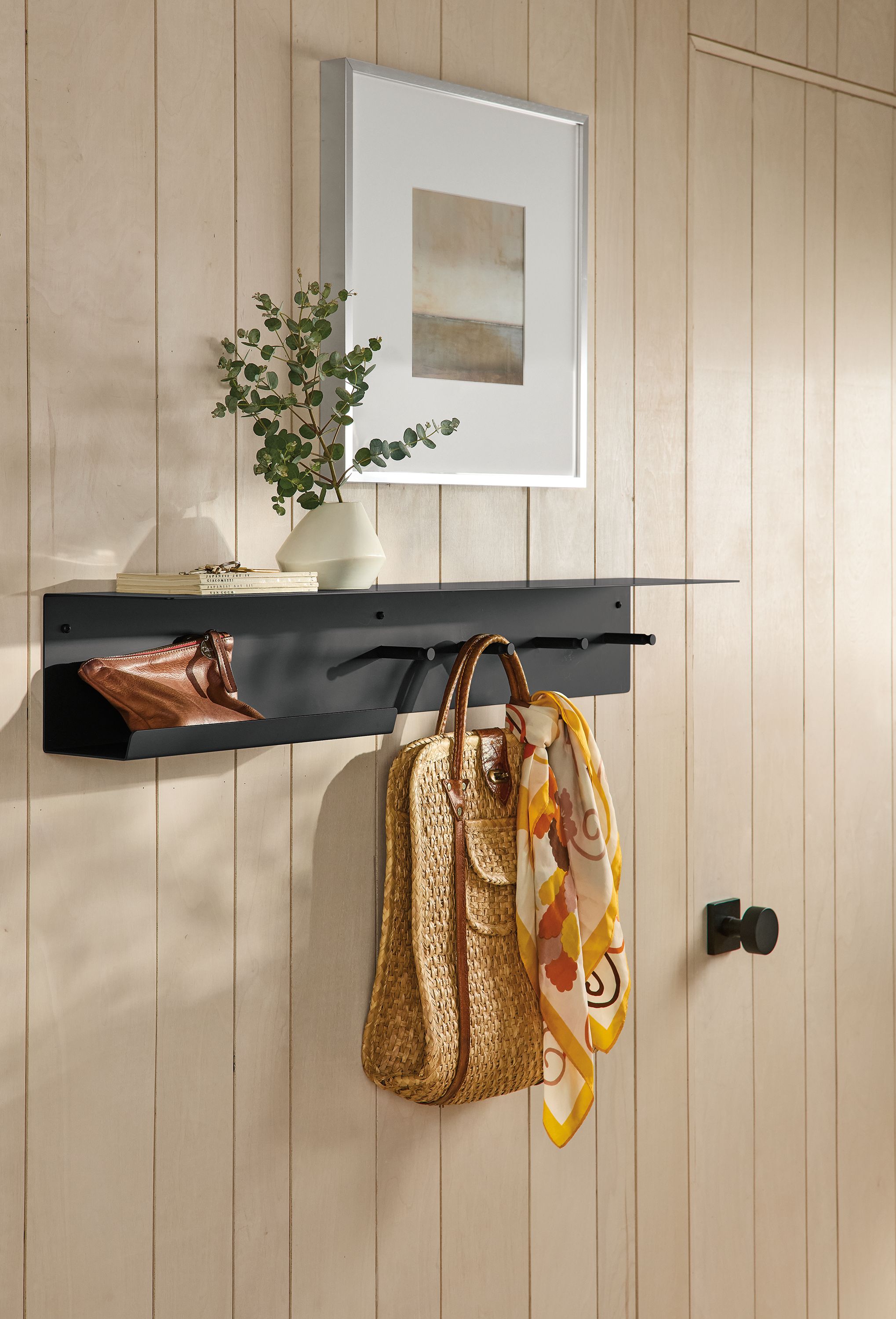 Entryway with Spike 36-wide wall shelf with hooks in graphite, profile frame in silver and anya bud vase in white.
