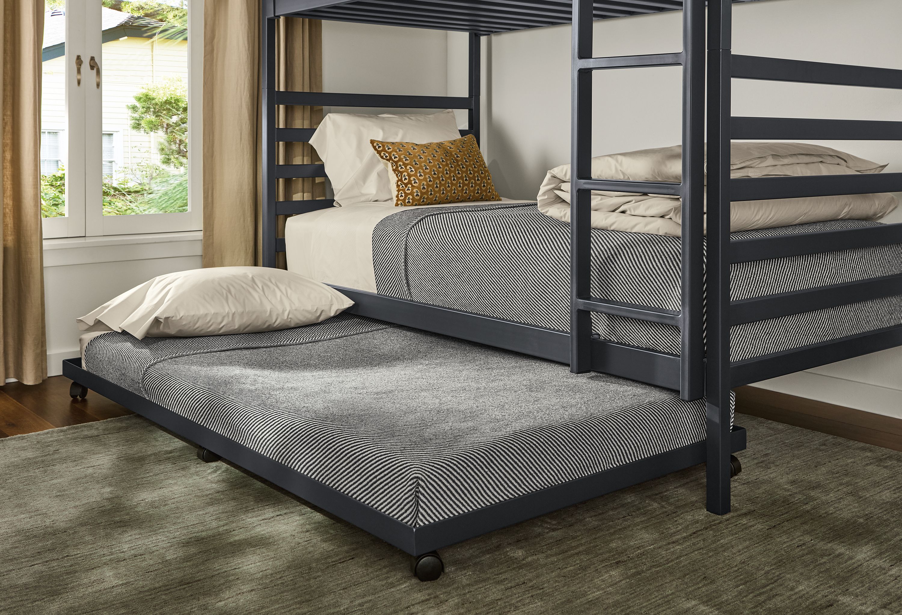 Bedroom with Fort twin over twin bunkbed shown with an extended steel twin trundle bed.