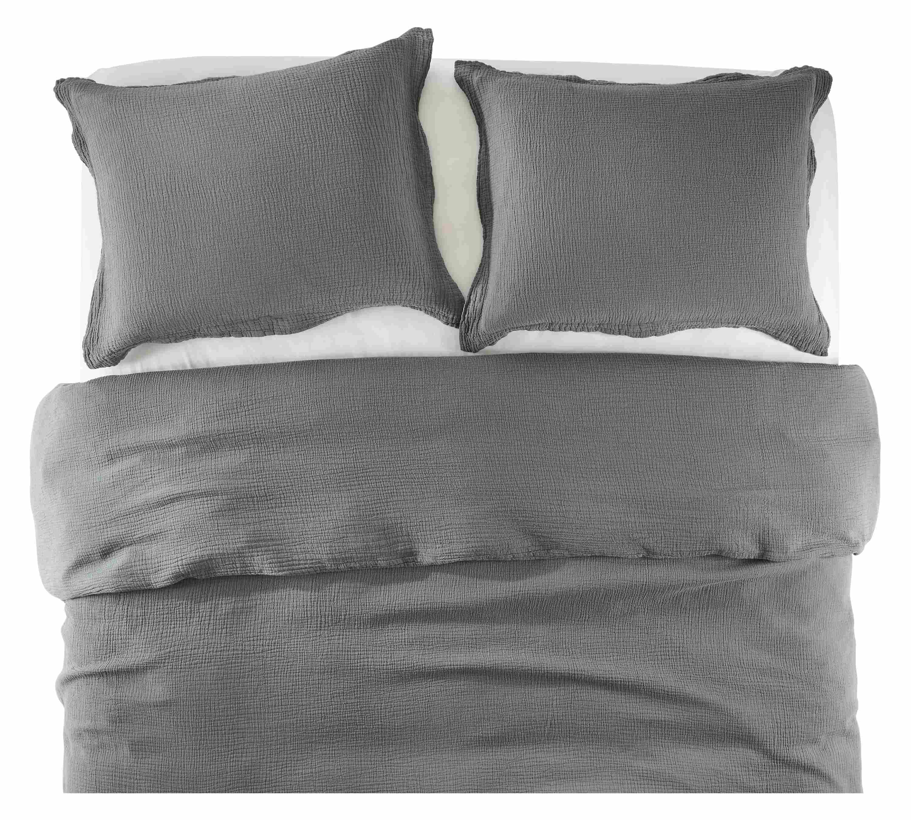Overhead view of core queen bed with strand gauze duvet set in dusk and percale sheets in white.