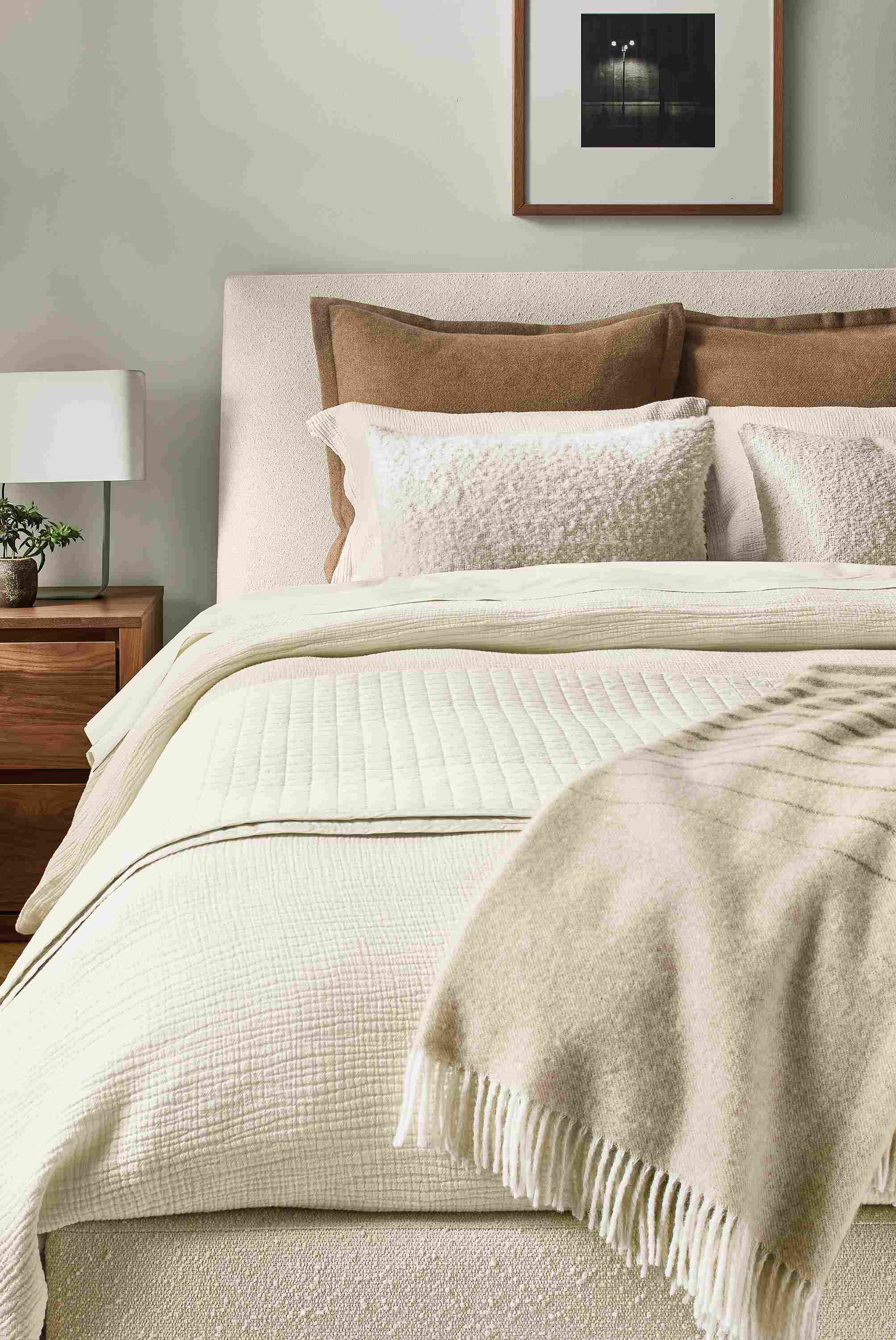 Bedroom with Strand gauze full/queen duvet set, signature percale coverlet and queen sheets all in ecru on an ella bed.