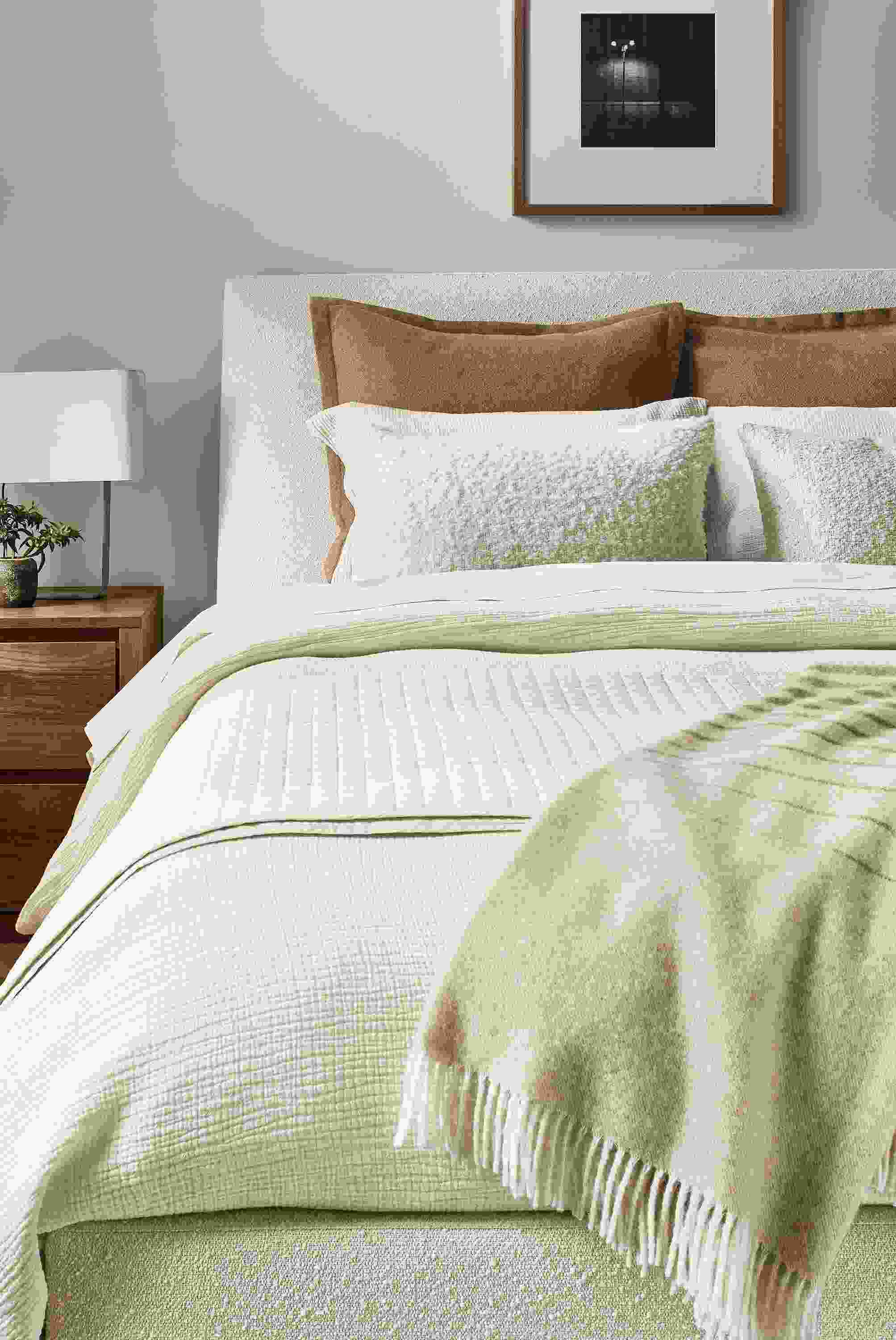 Bedroom with Strand gauze full/queen duvet set, signature percale coverlet and queen sheets all in ecru on an ella bed.