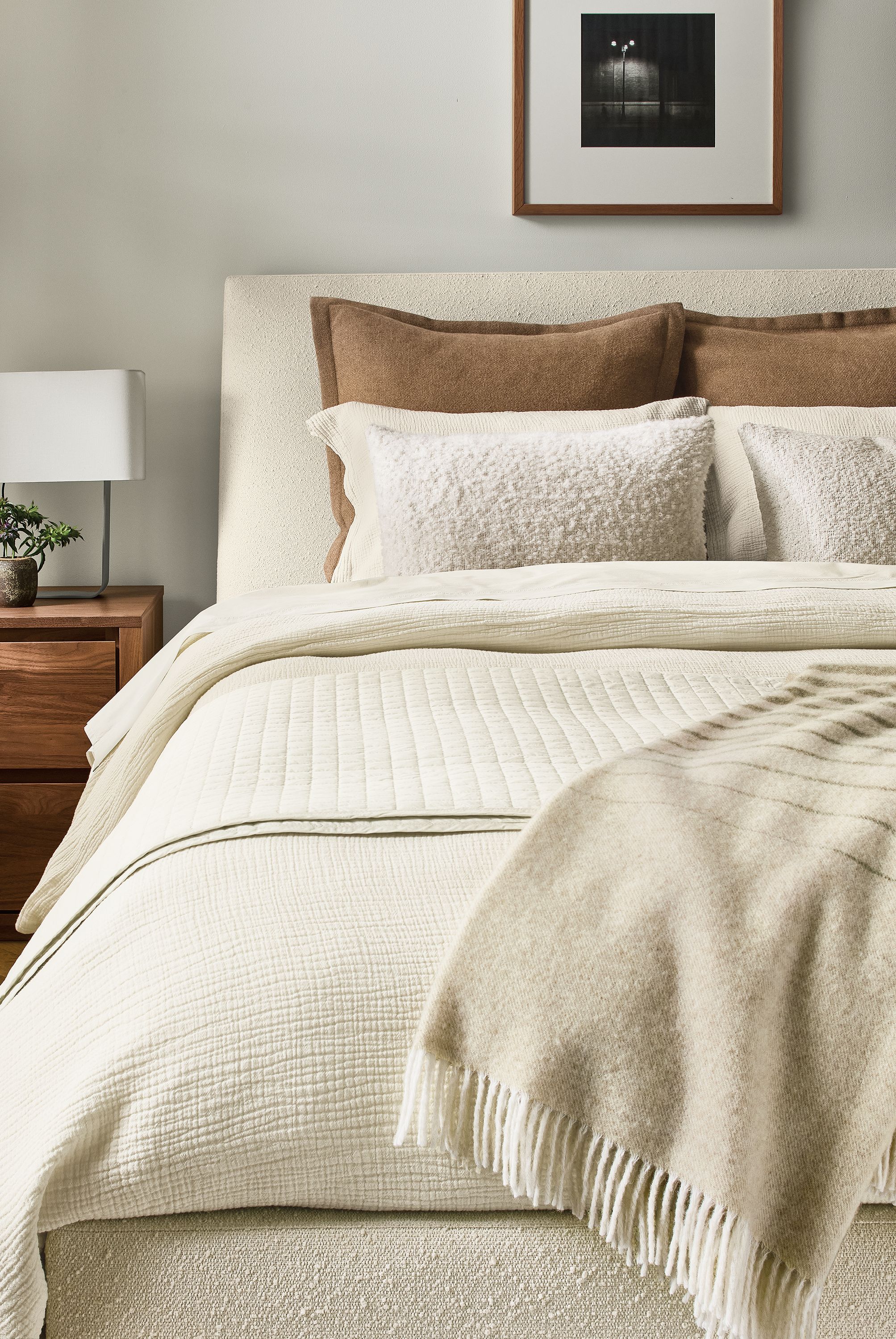 Bedroom with Strand gauze full/queen duvet set, signature percale coverlet and queen sheets all in ecru on an ella bed.