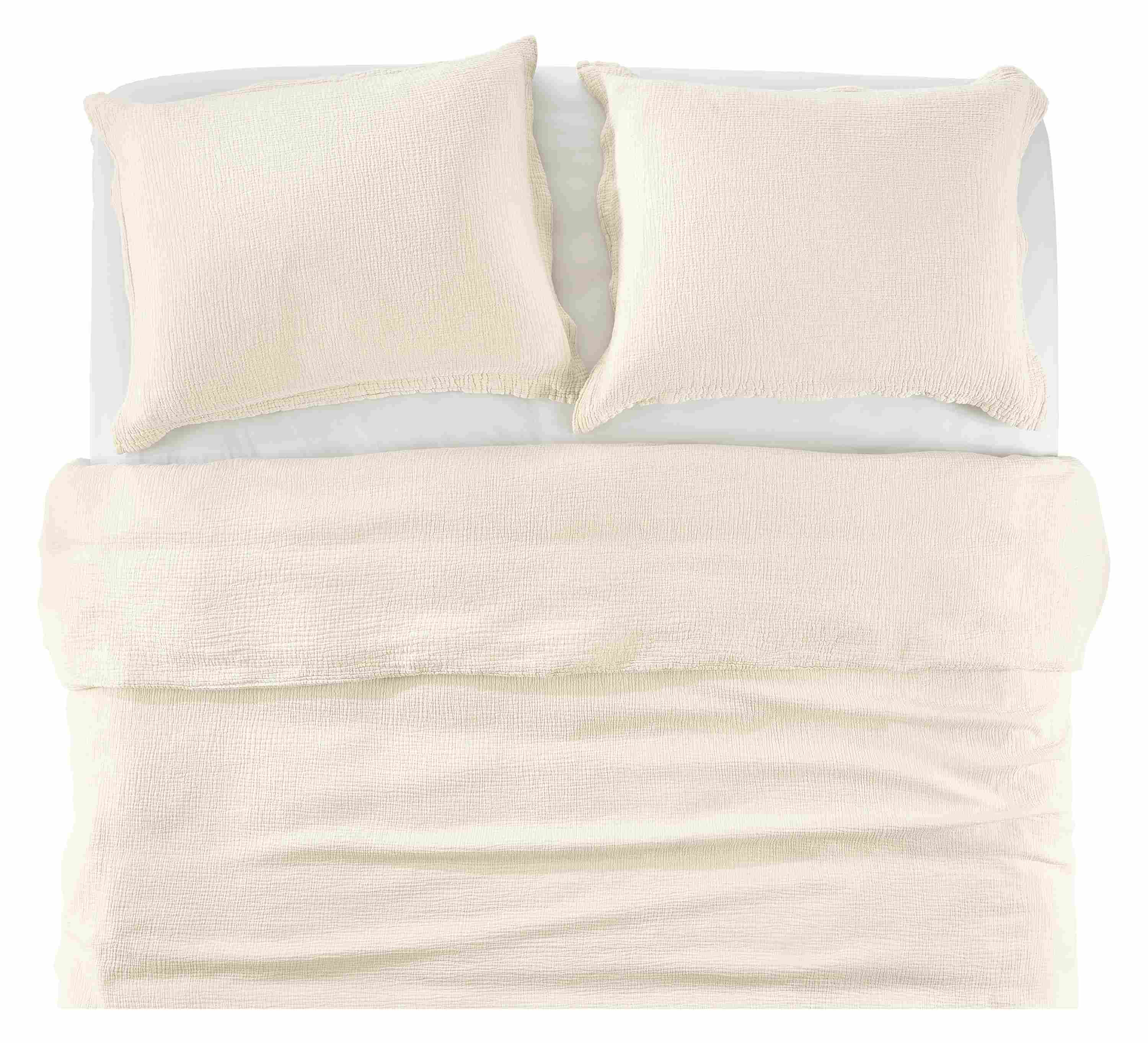 Overhead view of core bed with strand gauze duvet set in ecru, and percale sheets in white.