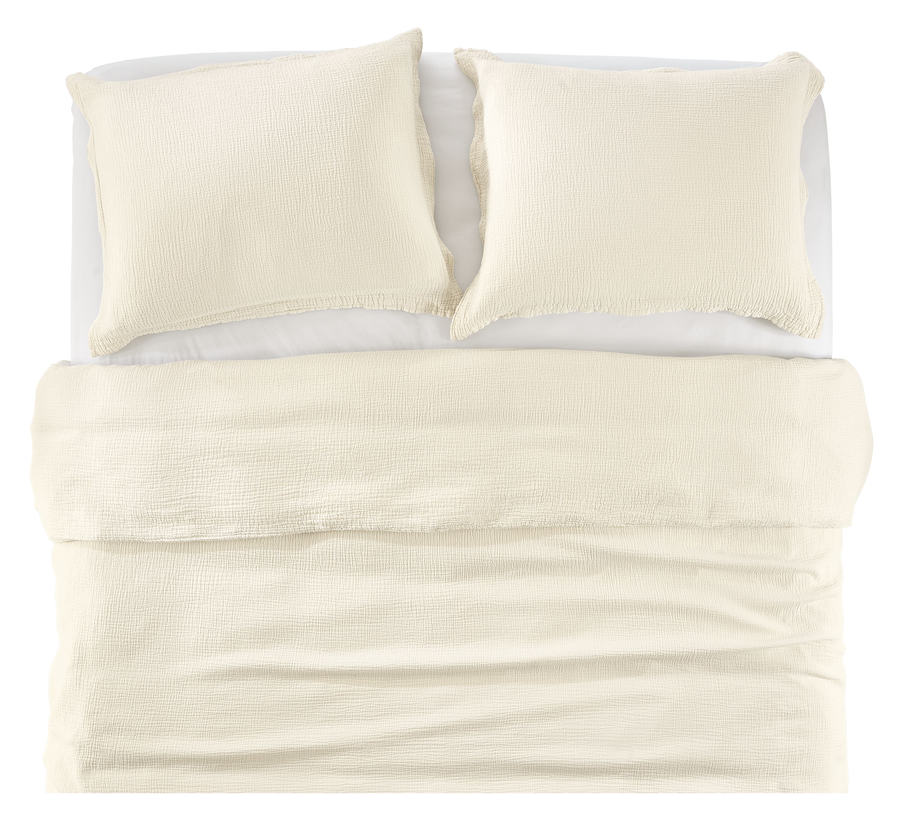 Overhead view of core bed with strand gauze duvet set in ecru, and percale sheets in white.