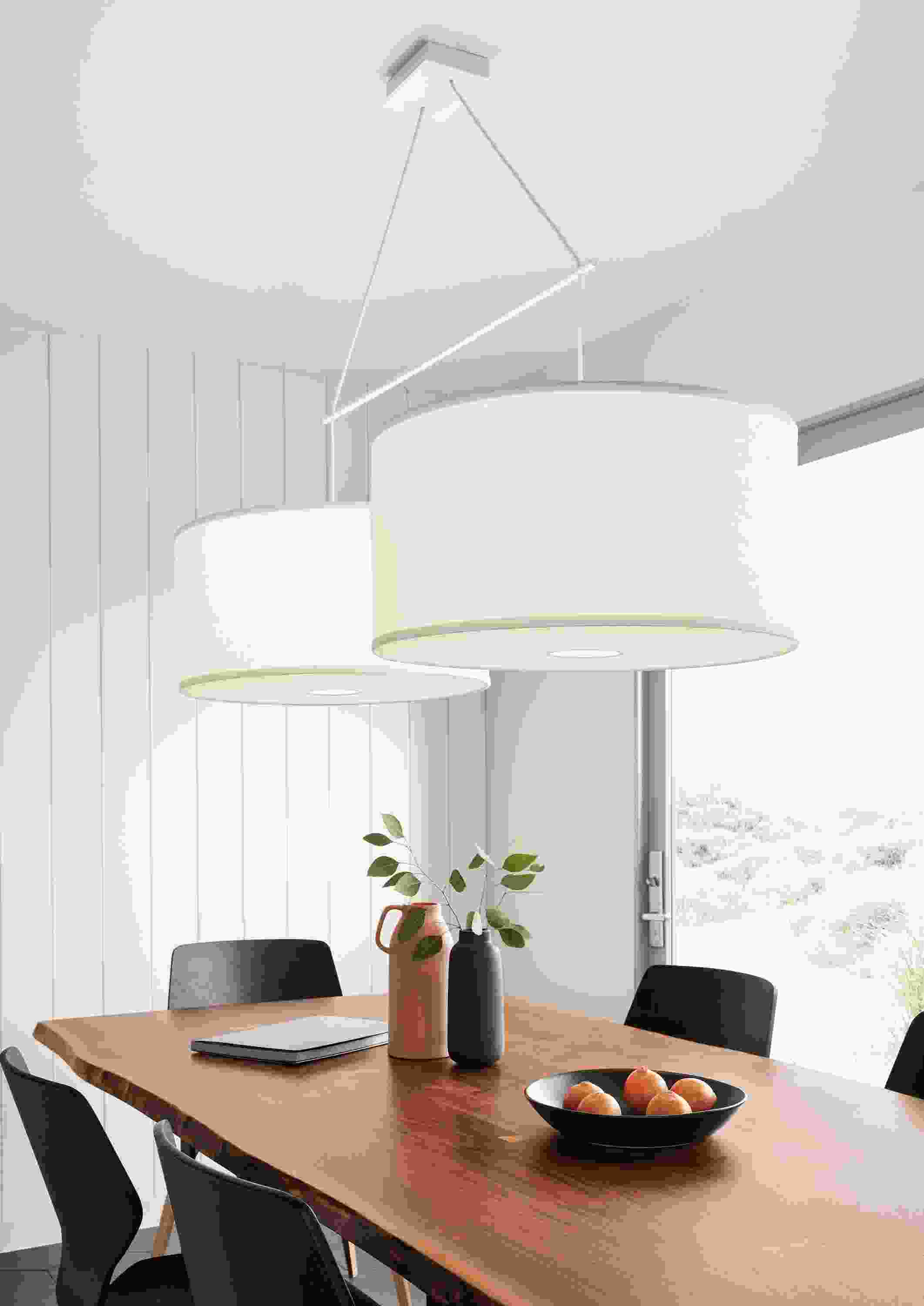 Detail of Studio round double pendant fixture with ivory white shades.