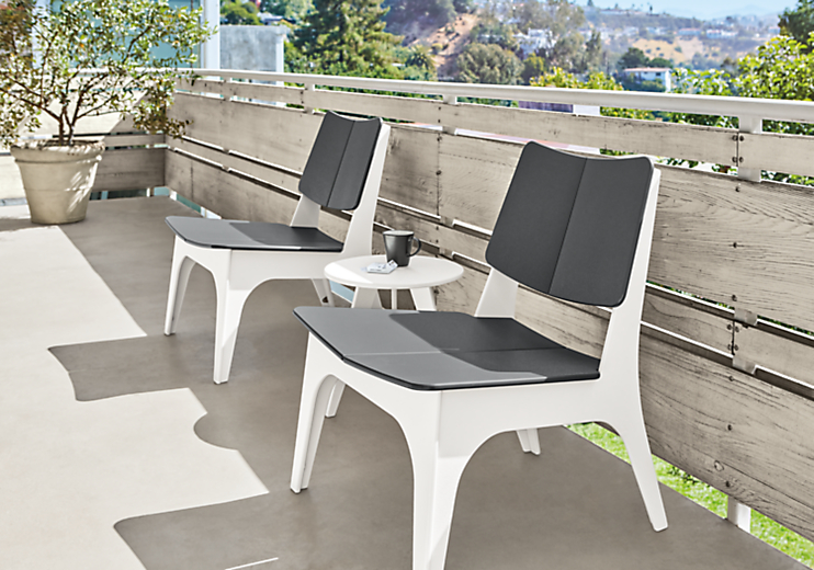 Detail of Sundby two-tone outdoor lounge chairs in grey and white.