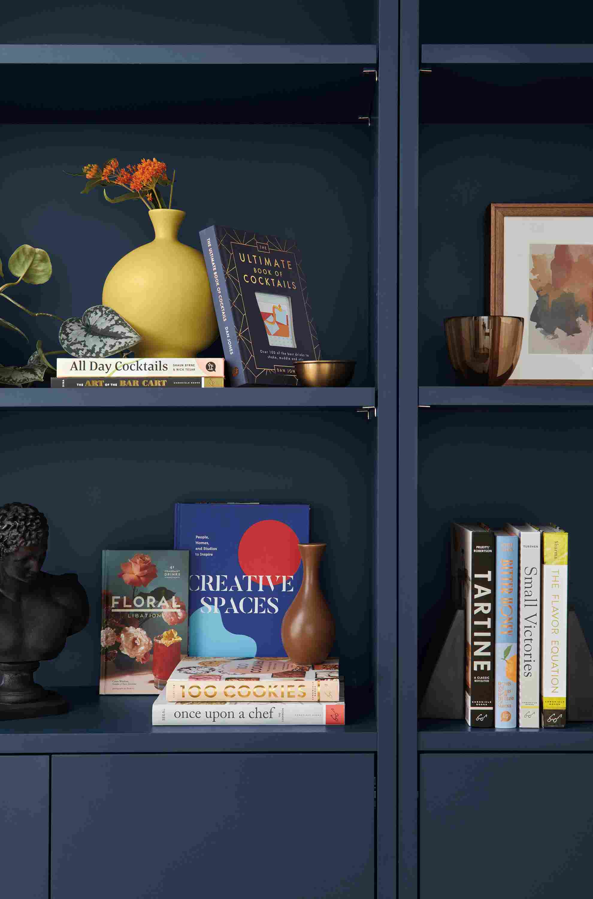 room setting including sur vase, copenhagen bookcases, wilson frame.