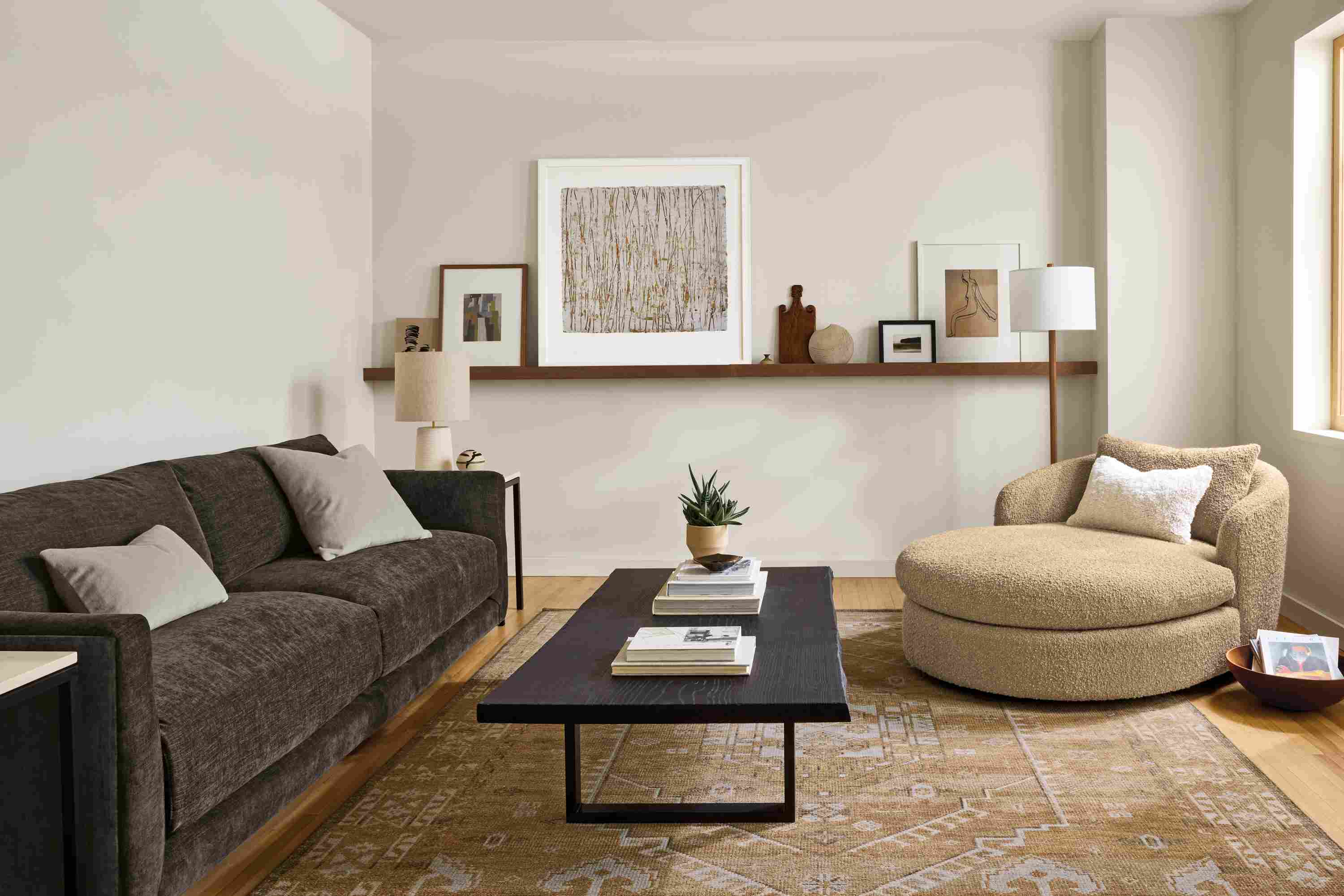 Living room with Suri chaise in Dornick Camel, Clemens sofa in Mori Charcoal and Darrah 8 by 10 rug in camel.