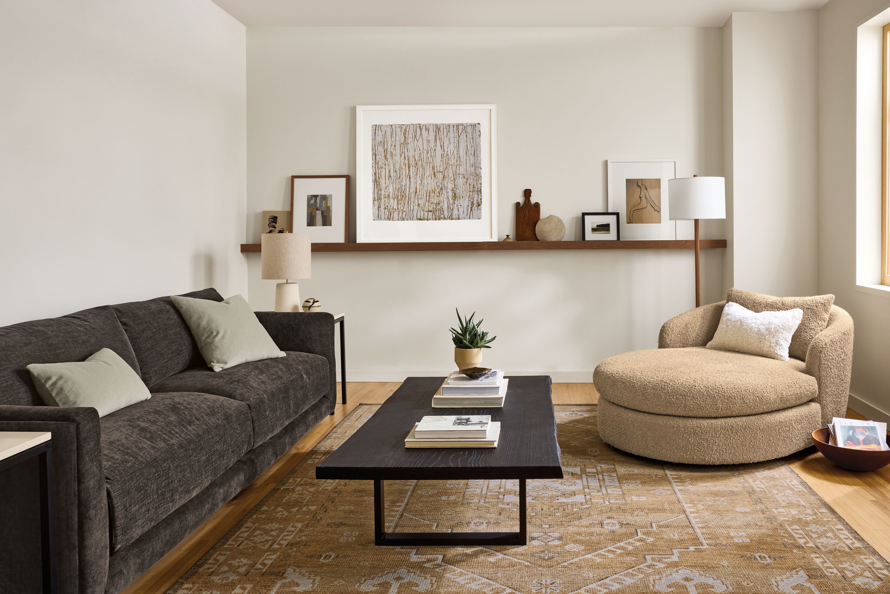 Living room with Suri chaise in Dornick Camel, Clemens sofa in Mori Charcoal and Darrah 8 by 10 rug in camel.