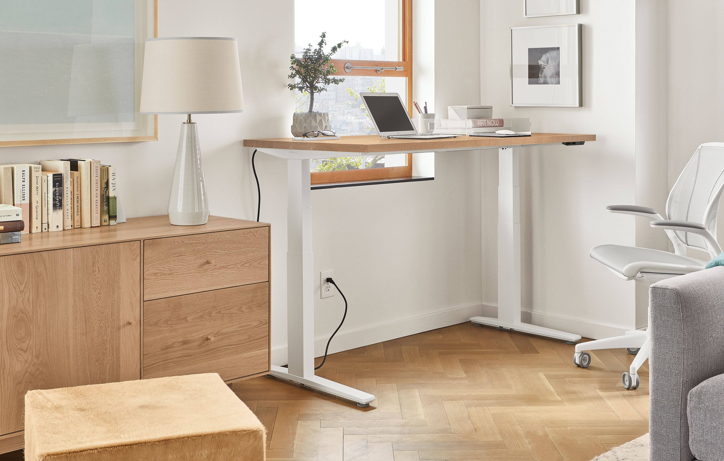60w desk with rye stain top and white base, raised to standing height