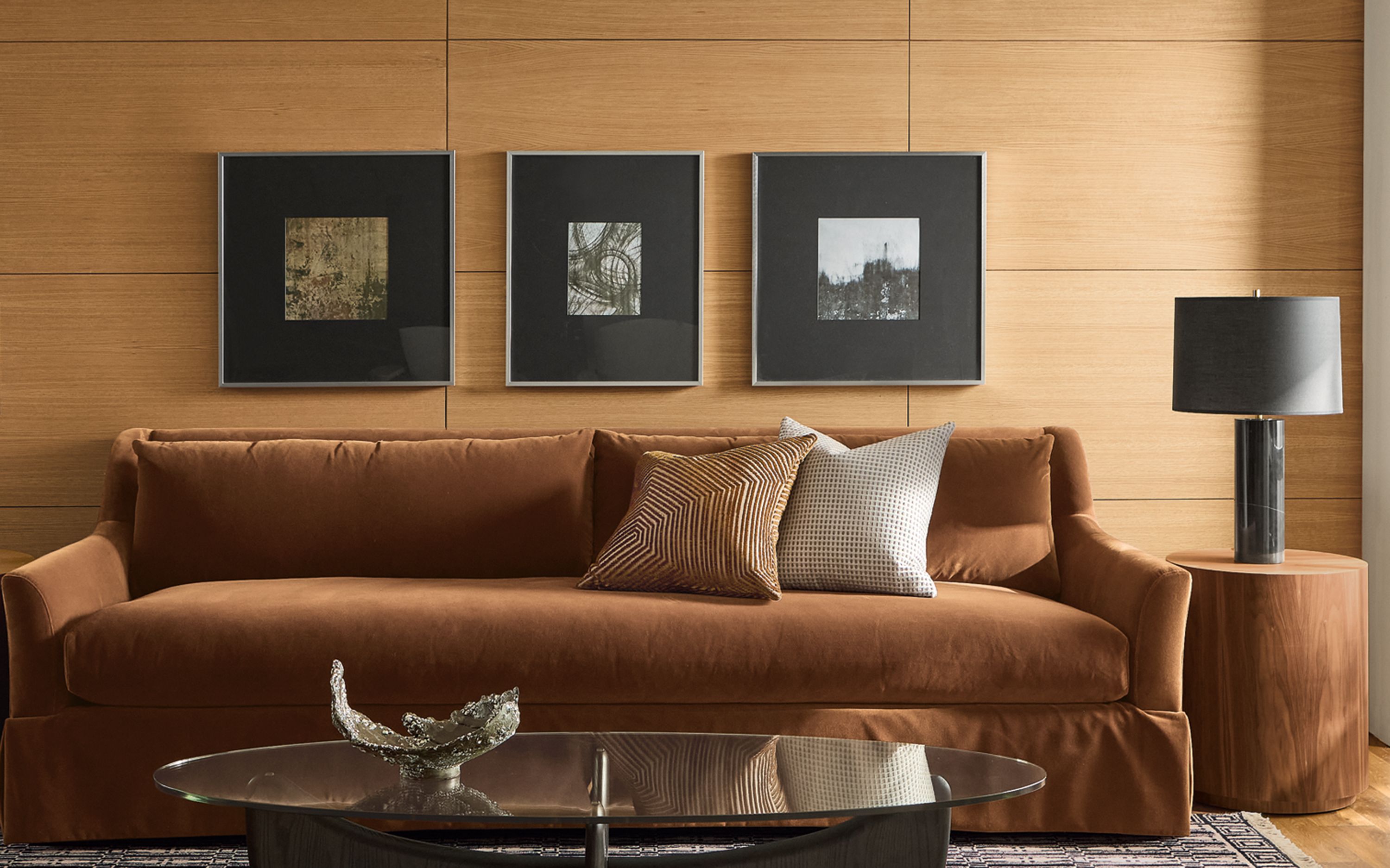 Sunny living room with Sybil skirted bench cushion sofa and Sybil chair in Redding Nutmeg and 2 Renew chairs in Terra Oatmeal.