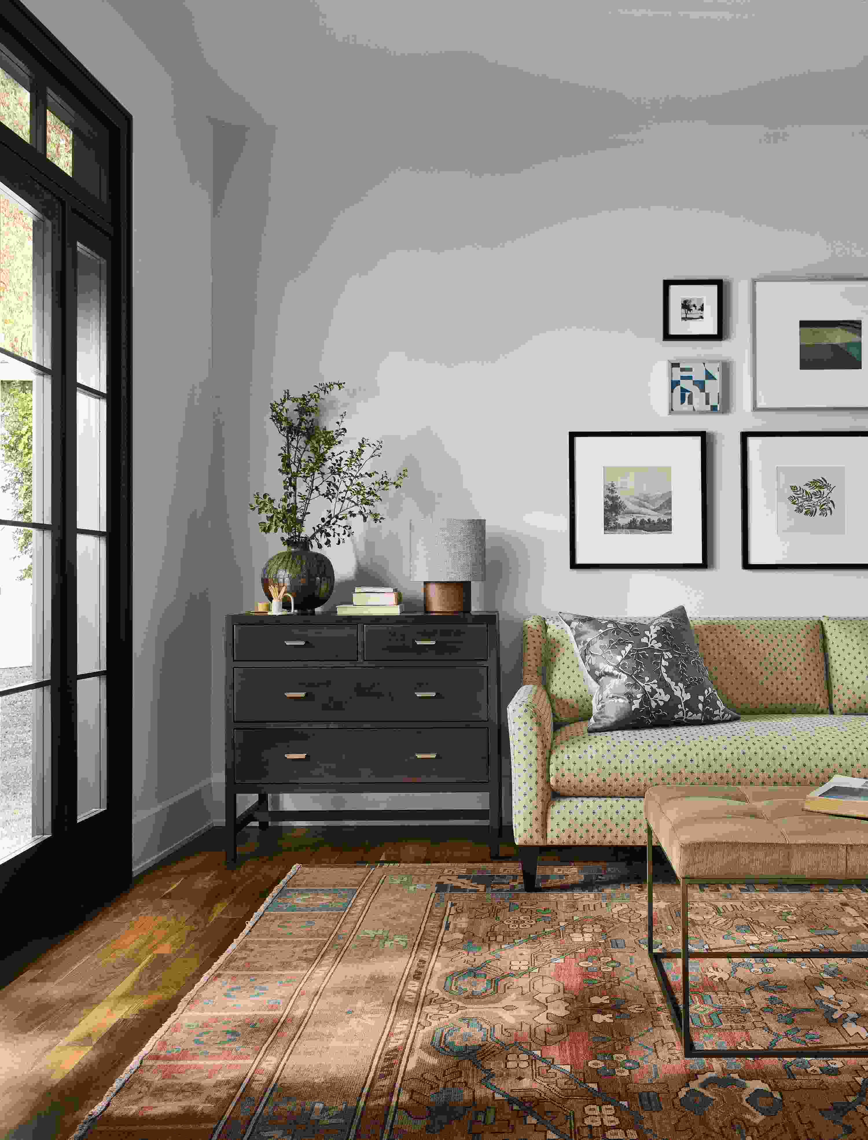 Living room with Sybil bench cushion sofa in Lockwood Natural, Berkeley 4-drawer dresser in charcoal and Kayseri rug in terracotta.