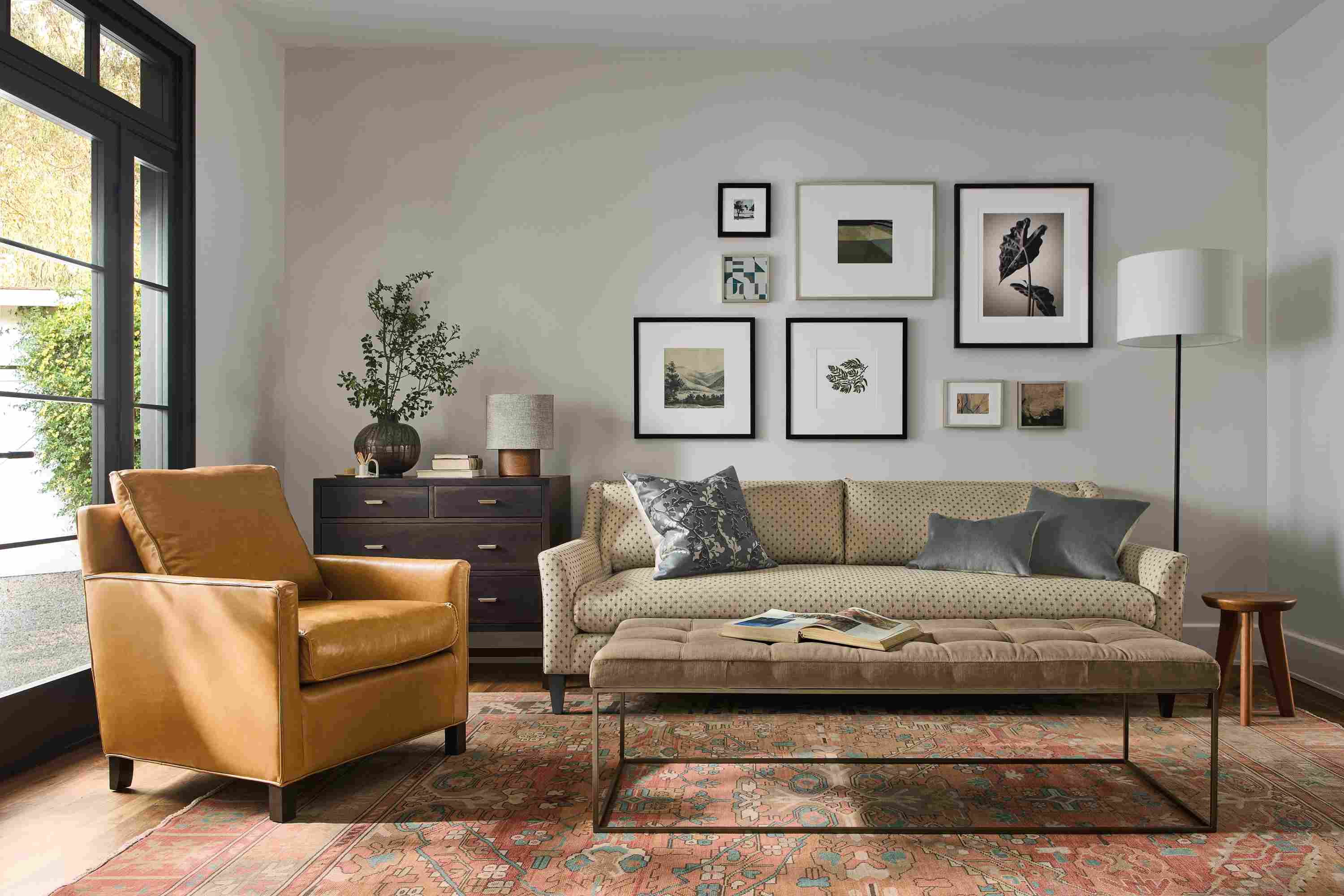 Living room with Sybil bench cushion sofa in Lockwood Natural, Bram chair in Vento Camel and Kayseri rug in terracotta.